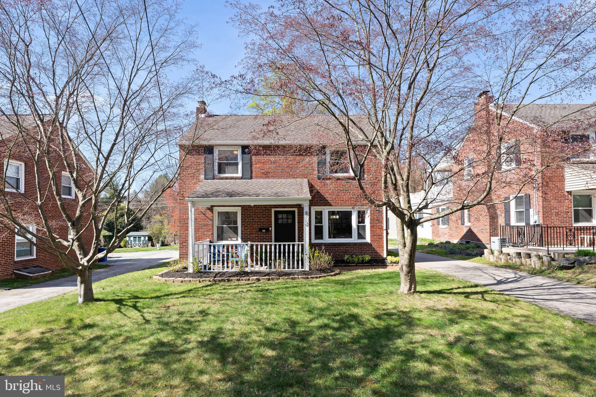 Welcome to 812 East Haverford Road in Bryn Mawr - with modern updates, charm and location - this home has it all! A pristine three bedroom Center Hall Brick Colonial just minutes away from everything that Bryn Mawr has to offer including shops, restaurants, parks, major commuter routes and much more! This beautiful home is situated on an extra large, level lot tucked far back off the road. The long, private driveway can host multiple cars, in addition to a one car attached garage. This home offers exceptional curb appeal from the moment you arrive! Enter the home onto a welcoming covered front porch and prepare to fall in love! Step inside to discover a bright and welcoming interior that has been lovingly maintained and thoughtfully updated. The spacious living room complete with a fireplace, features classic architectural details, beautiful custom built in shelving and cabinetry with lighting, and a beverage cooler. Adjacent to the living room, a casual dining room provides the ideal setting for entertaining or family dinners. The heart of the home is the updated kitchen with natural wood cabinets, quartz countertops, tile flooring, stainless steel appliances and white custom subway tile to the ceiling. There is also a backdoor in the kitchen to the rear driveway. The first floor boasts gleaming hardwood floors and abundant natural light, creating a warm and comfortable atmosphere. Upstairs, you will find a spacious primary bedroom complete with two closets, two additional bedrooms, and a full, and a clean and updated hall bathroom. Also, on the second floor is an entrance to the deck perfect for summer nights overlooking the backyard! The lower level is partially finished with a bonus area perfect for an office or playroom, a laundry area, a half bathroom and ample storage space. Do not miss this opportunity to own this immaculate, move-in ready gem in a prime Bryn Mawr location with top rated Haverford School District schools.
