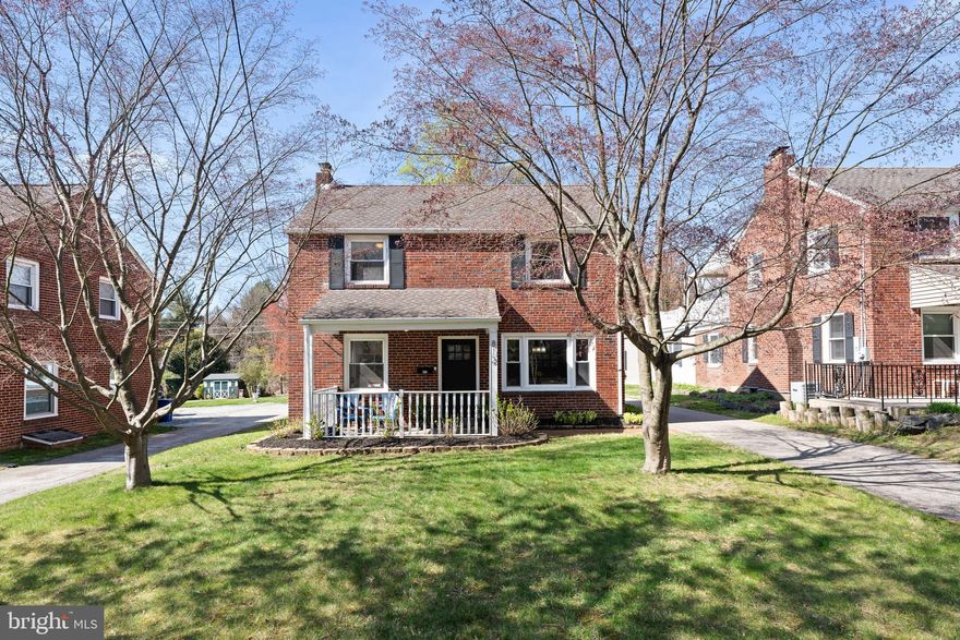 Welcome to 812 East Haverford Road in Bryn Mawr - with modern updates, charm and location - this home has it all!  A pristine three bedroom Center Hall Brick Colonial just minutes away from everything that Bryn Mawr has to offer including shops, restaurants, parks, major commuter routes and much more!  This beautiful home is situated on an extra large, level lot tucked far back off the road. The long, private driveway can host multiple cars, in addition to a one car attached garage. This home offers exceptional curb appeal from the moment you arrive!  Enter the home onto a welcoming covered front porch and prepare to fall in love!  Step inside to discover a bright and welcoming interior that has been lovingly maintained and thoughtfully updated.  The spacious living room complete with a fireplace, features classic architectural details, beautiful custom built in shelving and cabinetry with lighting, and a beverage cooler.  Adjacent to the living room, a casual dining room provides the ideal setting for entertaining or family dinners.  The heart of the home is the updated kitchen with natural wood cabinets, quartz countertops, tile flooring, stainless steel appliances and white custom subway tile to the ceiling. There is also a backdoor in the kitchen to the rear driveway.  The first floor boasts gleaming hardwood floors and abundant natural light, creating a warm and comfortable atmosphere.  Upstairs, you will find a spacious primary bedroom complete with two closets, two additional bedrooms, and a full, and a clean and updated hall bathroom.  Also, on the second floor is an entrance to the deck perfect for summer nights overlooking the backyard!  The lower level is partially finished with a bonus area perfect for an office or playroom, a laundry area, a half bathroom and ample storage space.  Do not miss this opportunity to own this immaculate, move-in ready gem in a prime Bryn Mawr location with top rated Haverford School District schools.