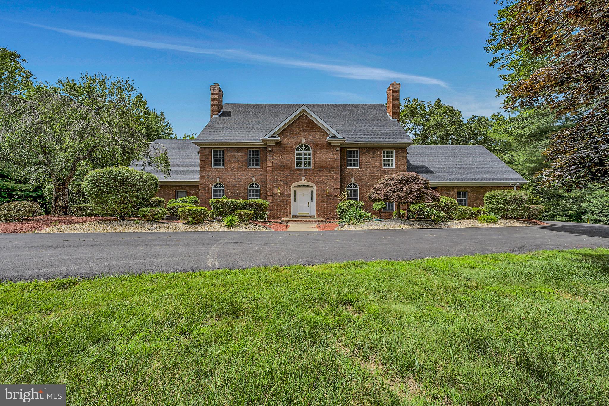 Discover unparalleled luxury in this sprawling all-brick Colonial, the ''Mansion on Main.'' Nestled on over 7 picturesque acres, boasting 8 bedrooms, 8 bathrooms, and more than 10,000 square feet across three expansive levels. This estate seamlessly blends modern sophistication with timeless elegance. Perfect for both grand entertaining and serene living, this elusive gem offers unmatched
amenities and outdoor spaces. Interior Highlights: Grand 2-Story Foyer with a stunning spiral staircase, Gourmet Chef's Kitchen featuring commercial-grade appliances and custom cabinetry, Soaring 2-Story Great Room anchored by a stone wood-burning fireplace, Opulent First-Floor Primary Suite with a spa-inspired, ultra-modern bath, Gleaming Hardwood Floors throughout, and Expansive Lower Level with a guest suite, theater, custom bar, and arcade.