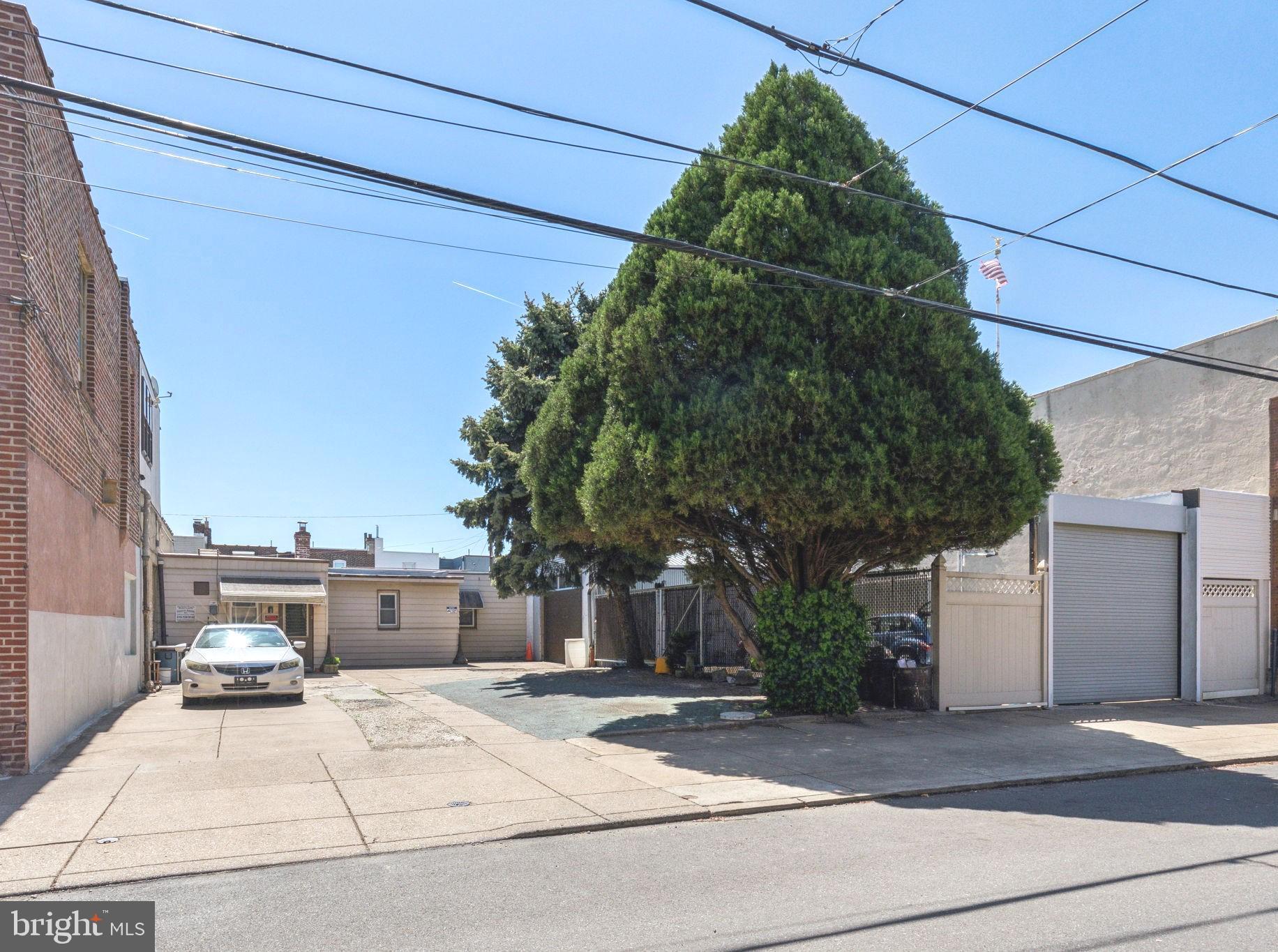 Large versatile property with 4 garages: You can work & live at the same address... Easy, 1 floor living. Ranch home, 2 bdrms & 1 bath with a basement, 3 standard garages, plus a huge 4th garage (20 x 26) with a 14 ft ceiling and an oversized 12 x 10 power garage door. Also there's a large fenced-in side yard, with another 12 x 10 power garage door for secure parking (4 cars). Plenty of space for storage or off street parking for 8+ cars or trucks. Perfect for a contractor or anyone who owns their own business. The house has a living rm with an exit to the back 3 garages on Webb St, large kitchen (refrig included), 2 bdrms, 1 bath and a basement with laundry area (W/D included). NEW heater, NEW water heater and NEWER windows. Quiet and safe location. Property runs from Thompson St to Webb ST. Quick access to I-95. *Next door, 3353 E. Thompson is also for sale, same owner. View both properties.