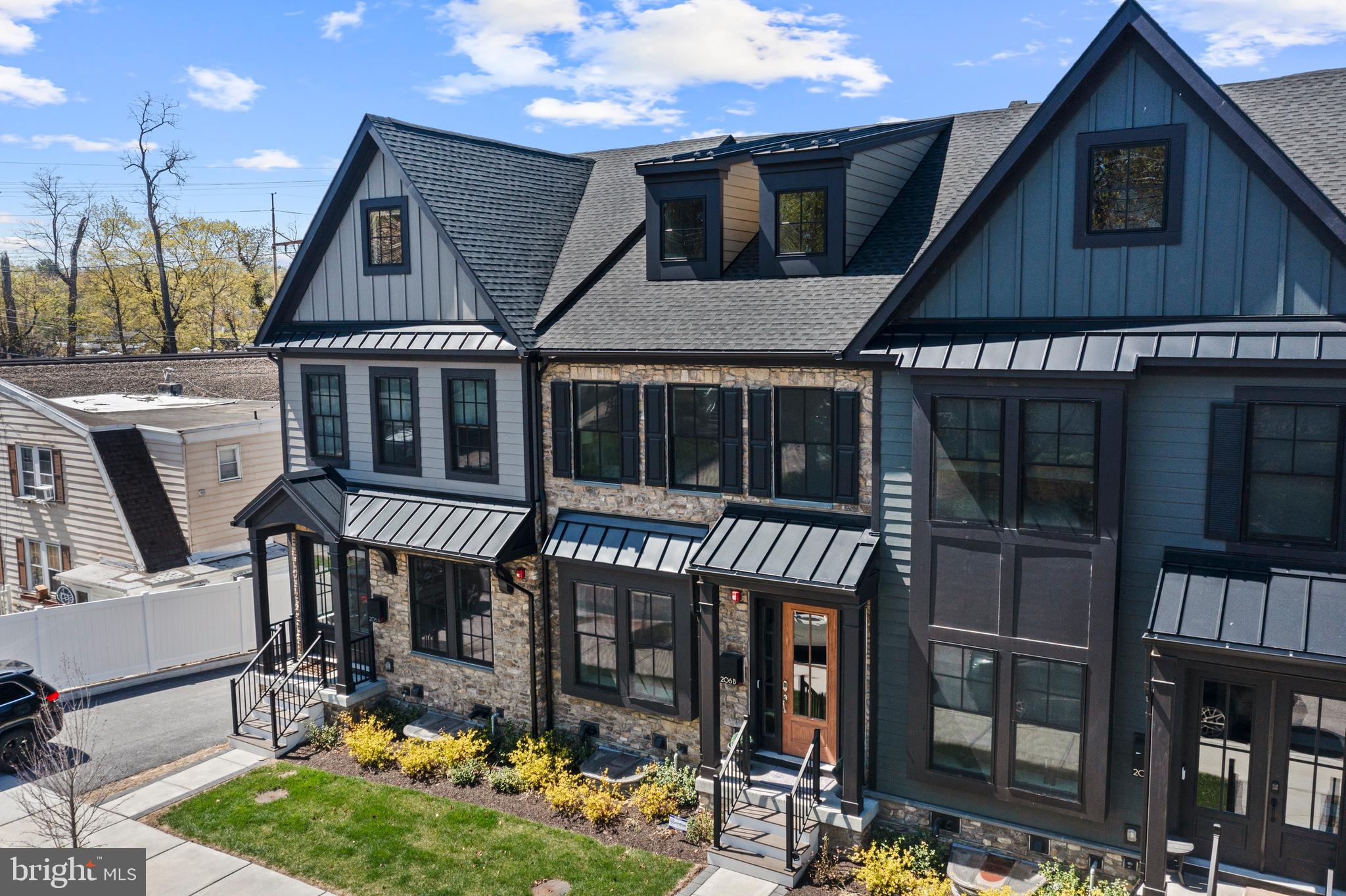 A rare opportunity to own a nearly new resale at Rockwell on Aberdeen, an exclusive 6-townhome luxury community in the heart of Wayne. Built in 2022 by Rockwell Homes, this townhome offers 3 bedrooms, 3 full and 2 half baths, and a sophisticated blend of modern design, high-end finishes, and smart home technology.
Spanning four spacious levels with an elevator (3 stops), this home offers 2,908 sq. ft. of beautifully crafted living space, including a finished lower level, a third-floor loft and attached garage. You will find exceptional design and high-end finishes inside and out.
The exterior features include James Hardie Cement Siding, Black Pella Windows- Lifestyle Series, a Composite Deck with Privacy Walls, and professional landscaping.
Enter the home through the covered front portico and wood framed door with glass panels. Gorgeous engineered 5” wood floors, 10” ceilings, coffered ceilings, large modern windows, soothing paint colors and stunning finishes welcome you. The sun-lit dining room features wainscotting and is open to the gourmet kitchen. The kitchen, in the center of the home, includes an extra-large 12’ island with seating for 6 outfitted with luxury white cambria quartz with veining, which is also used for the backsplash. Pendant lighting and custom two-toned 48” cabinetry - white cabinets throughout except for black cabinetry found on the island - create much visual interest. The kitchen also includes a custom wood hood, high-end JennAir stainless steel appliances including a 30” double convection wall oven. This kitchen is the perfect space for everyday cooking as well as entertaining. Just beyond, a sophisticated great room awaits. It is centered around a floor-to-ceiling quartzite fireplace. The coffered ceiling emphasizes the 10’ height and provides warmth, style and elegance. This room provides access through black framed sliding doors to a private rear deck, ideal for morning coffee or evening relaxation. A powder room is conveniently located off of the great room.
The attractive staircase features modern oak rails with metal balusters and oak stairs with white painted risers. Engineered hardwood floors continue on the upper level. The luxurious primary suite features a tray ceiling and ceiling fan and two walk-in closets outfitted with designer shelving systems. A spa-like bath offers dual vanities, Moen chrome centerset faucets, quartz countertops, a private water closet, and a large walk-in frameless chrome shower door with built-in niches and dual showerheads. Also found on this level are a second en-suite bedroom, and the conveniently located laundry area. Continuing upstairs to the generous sized third-floor loft with a full bath (3). This level provides versatility as bedroom 3, a guestroom, a home office, or a bonus space.
The flexible Lower Level also offers engineered hardwood flooring, recessed lighting, as well as a window egress. It is the perfect space for a home office, gym, or second lounge area, complete with a powder room, the second in the home. It also provides direct access to the rear-entry two-car garage.
Situated just 0.5 miles from the Wayne Train Station, with direct service to Philadelphia and NYC, and located in the top-ranked Radnor Township School District, Rockwell on Aberdeen delivers both unmatched convenience and low-maintenance luxury living. This home offers walkability to Wayne’s many restaurants, including Rosalie, 118 North, Christopher’s, The Goat’s Beard, and more. Nearby shopping includes the many shops in Wayne such as Best Hardware and Boyds. Just beyond Wayne you will find Terrain and Whole Foods Market in Devon, Estia Taverna in Radnor, Eagle Village Shops and restaurants, Strafford Farmers Market, DiBruno Bros, The Radnor Trail, Chanticleer Garden, Wayne Art Center, and King of Prussia Mall and so much more.
Don’t miss your chance to own this nearly new resale!