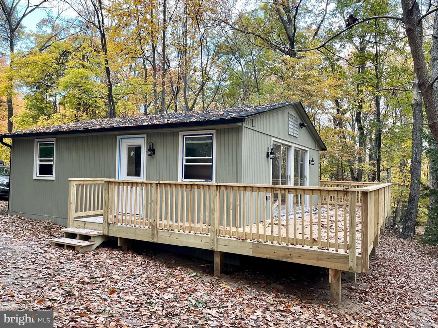 Completely remodeled cabin in Sleepy Hollow. The back line of the property is adjacent to Sleepy Creek Wildlife Management which is  23,000 acres of public land. You are just a short walk from the Devil's Nose trailhead. Live where you play! 
Completely remodeled with new roof, all new electric and plumbing, new drywall, new flooring, new windows and doors, new kitchen... it's all new! 
Don't let the small square footage deter you. "Less House...More Home"