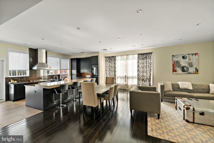 A center city home where you can have it all!  1501 Kater Street offers an incredible, open, sun-drenched space.  On a double sized corner lot, this modern, architect designed home boasts 4 bedrooms, 3.5 baths and an SUV ready two-car garage.  Enter the ground floor into a wide foyer with double coat closets.  Ground floor consists of a large bedroom with heated floors, a full bath, a spacious home office/den and rear patio. Upstairs the main floor has 10" ceilings with wide plank black birch floors, oversized living room, powder room, massive gourmet kitchen with Sub-Zero refrigerator & 2 Sub-Zero refrigerator drawers, Sub-Zero tall wine fridge, 36' Wolf appliances including induction cooktop, wall oven, steamer, microwave & warming drawer, Miele built-in coffee machine, Bosch dishwasher, stone clad counters and backsplashes along with outdoor deck off the kitchen. On the main floor, there is also a formal dining room/play room.  The third floor features a huge primary bedroom with two walk in closets and en-suite primary bathroom with a steam shower, heated floors and jacuzzi tub.  This floor also has two bedrooms, a full bath with 6" whirlpool tub and laundry room. Straight stairs to a stunning roof deck with spectacular city views updated with custom pavers, shade with steel shade frame and a fire pit.  Other features include built in speaker system in the living room and primary bedroom, a fully finished basement with a screening/media room with a projector and surround sound.  Move-in ready in a highly desirable neighborhood close to public transportation, restaurants, shopping and parks.  There is room for a third  car parking in front of the garage.