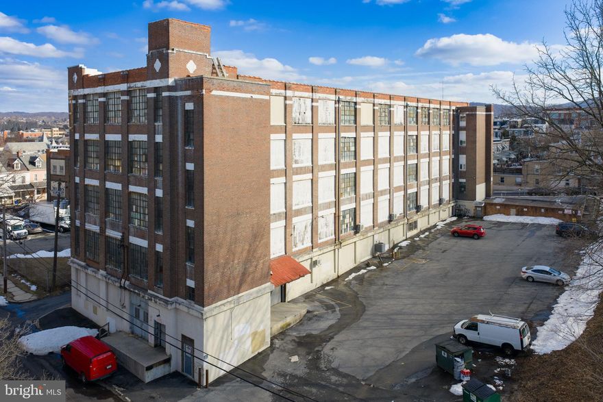 5 story, 62,500 sq ft Light Industrial building. Each floor is 12,500 sq ft. There are two additional 1st floor rooms not included in the sq footage. Solid concrete, steel building with brick facade. Freight elevator, two loading docks which receive daily deliveries. Completely updated fire/sprinkler system, natural gas heating, and entire vinyl/rubber roof is new in 2024. Entire 'alley' side brick has been repointed inside and out. Multi-tenant occupied building. Located right before you enter onto the 8th St bridge heading into Center City Allentown. Minutes to I-78.