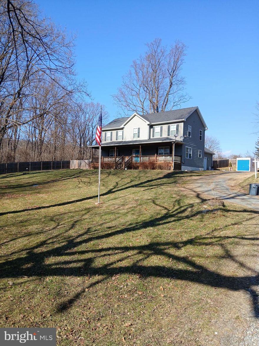 Get ready to fall in love with this open floor plan, on over 1 acre of land.  a peaceful escape. Hardwood floor, and  plenty of space. Large front porch.  A MUST SEE!!