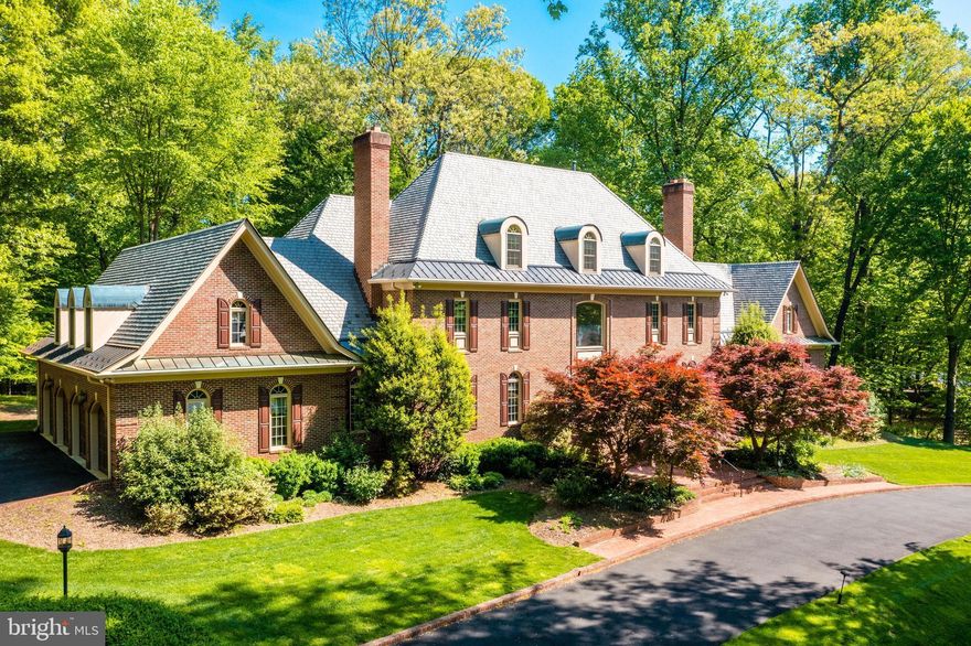 Open Saturday April 15th from 12pm to 2pm.

Impressive 8 bedroom, 7 full and 3 half bath estate on a 1.8 acre corner lot, you won't want to miss this exciting opportunity in the highly desirable Falcon Ridge neighborhood. Lush front and back yards with gorgeous landscaping, a slate patio, 4 car attached garage, and a circular driveway with entrances on Falcon Ridge Rd and Cottesmore Ct. 

Inside, you are greeted by a 2-story grand foyer with a dual curved staircase and granite floors for a dramatic entrance. The main level floor plan includes a formal dining and sitting room, each with custom gas fireplace mantels, and a music room with gorgeous large windows looking out to the trees. Upgrades include charming crown molding and trim, chair railing, and gleaming hardwoods throughout. French doors off the dining room lead into the gourmet eat-in kitchen with quartz island countertop, cherry wood cabinets, updated porcelain tile flooring, and recessed lighting. Recently upgraded kitchen appliances include a 5-burner gas cooktop, dual dishwashers and a Sub-Zero refrigerator. The cozy and inviting living room has a wet bar, built-ins, and a centerpiece floor to ceiling stone mantel fireplace. The main level also includes a spacious bedroom and a full bath - perfect to use as an in-law suite - a laundry room, and 2 powder rooms. 

4 generous bedrooms upstairs include a luxurious primary suite with vaulted ceilings, custom fireplace with gas hookup, and walk-in closets. The en-suite bath features his-and-hers separate vanities, a soaking tub and skylight to brighten up the space. Off the primary suite, a hallway leads down to a separate office space and a half bath, perfect for working from home! Enjoy conveniently located laundry on the second level as well. The attic has been finished to feature a 6th bedroom and 5th full bathroom and showcases skylights and dormers for plenty of light and charm. 

The lower level houses a separate au-pair suite with a full bedroom and bath, kitchen, and exterior entrance. Customize the rest of the space to fit your needs with an additional bedroom and full bath, a sauna, wine cellar, and wet bar as well as plenty of space for living and playing! Ample storage space and a 5-zoned HVAC, new within the last 2 years. 

Fantastic location in the heart of Great Falls while enjoying a neighborhood feel. Enjoy being able to take your dog for a walk, or go on an adventure to the Potomac River. Close by to shopping and dining in the Village of Great Falls, and major commuter routes.