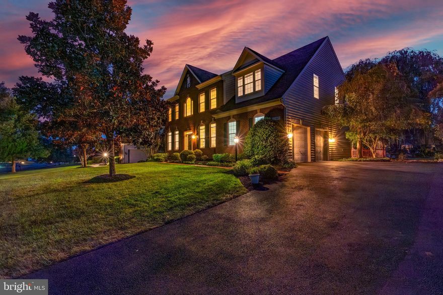 Welcome to this stunning colonial home in the highly sought-after Belle Terra neighborhood, feeding into the award-winning Briar Woods school pyramid. Situated on nearly a half-acre lot, this residence offers 5 bedrooms and 4.5 bathrooms across three beautifully finished levels. Step into the grand 2-story foyer, where a striking chandelier sets the tone for the home’s elegant design. The main level boasts gleaming hardwood floors, extensive crown molding, and an abundance of natural light throughout. Entertain guests in the formal dining room and spacious living room, or work from home in the private office with French doors. A convenient main-level laundry room adds ease to daily living.

The gourmet kitchen is the heart of the home, featuring a large center island, quartz countertops, stainless steel appliances, wall oven, cooktop, and bright white cabinetry. The kitchen opens directly to the expansive backyard and flows seamlessly into the family room, complete with a cozy fireplace.

Upstairs, you’ll find five generously sized bedrooms and three full bathrooms. The luxurious primary suite offers a private sitting area, dual walk-in closets, and a spa-inspired ensuite bathroom with dual vanities, a soaking tub, and a separate shower. All additional bedrooms are generously sized, providing comfort and flexibility for family or guests.

The fully finished lower level extends your living space with luxury vinyl plank flooring, a second kitchen/bar equipped with wine fridge, dishwasher, and range, as well as a spacious recreation room perfect for gatherings. Enjoy movie nights in the dedicated theater room with projection screen, or make use of the additional bonus room. This level walks out to the expansive backyard with a brick patio, lush lawn, and mature trees offering beauty and privacy.

Additional features include an attached garage with two high-voltage outlets for electric vehicle charging—perfect for today’s modern lifestyle.

This Belle Terra home blends elegance, functionality, and comfort—perfect for everyday living and entertaining alike.