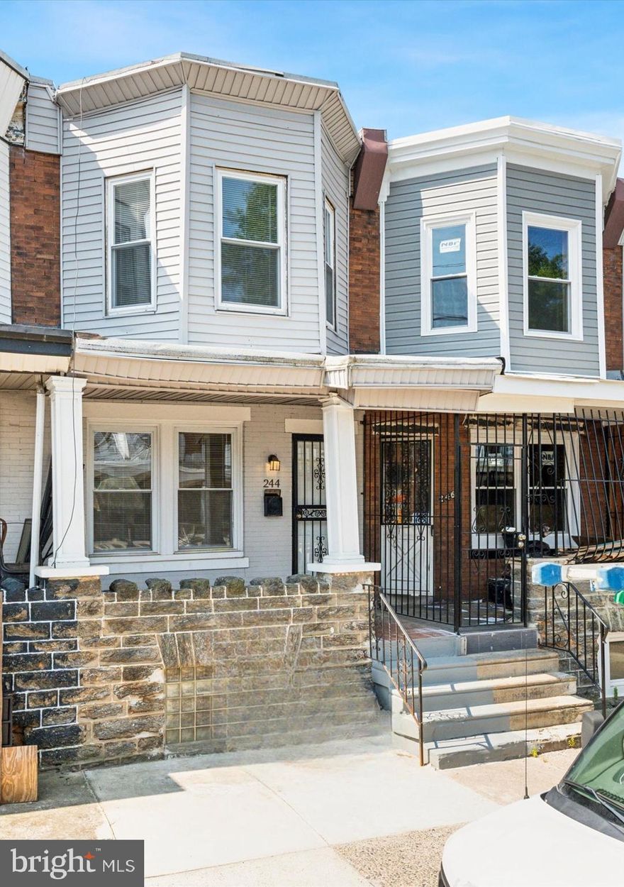 Completely renovated in 2023, this home offers modern amenities and classic charm. The porch is welcoming and provides a perfect place to relax and enjoy the weather. Inside, you'll find new windows, original hardwood floors, designer fixtures, and a finished basement. The stunning kitchen features modern gray shaker cabinets, quartz countertops, and stainless steel appliances. A half bath was added on the first floor for convenience and has modern fixtures and finishes. Upstairs the bedrooms are spacious, offering ample closet space, modern lights, and charming original wood floors. The full bathroom is a relaxing retreat with tub shower combo, sliding glass doors, skylight, and sleek fixtures. The basement is finished and perfect for an office, gym, den, lounge, or whatever you can imagine. Close to Roosevelt Blvd and major public transportation routes.