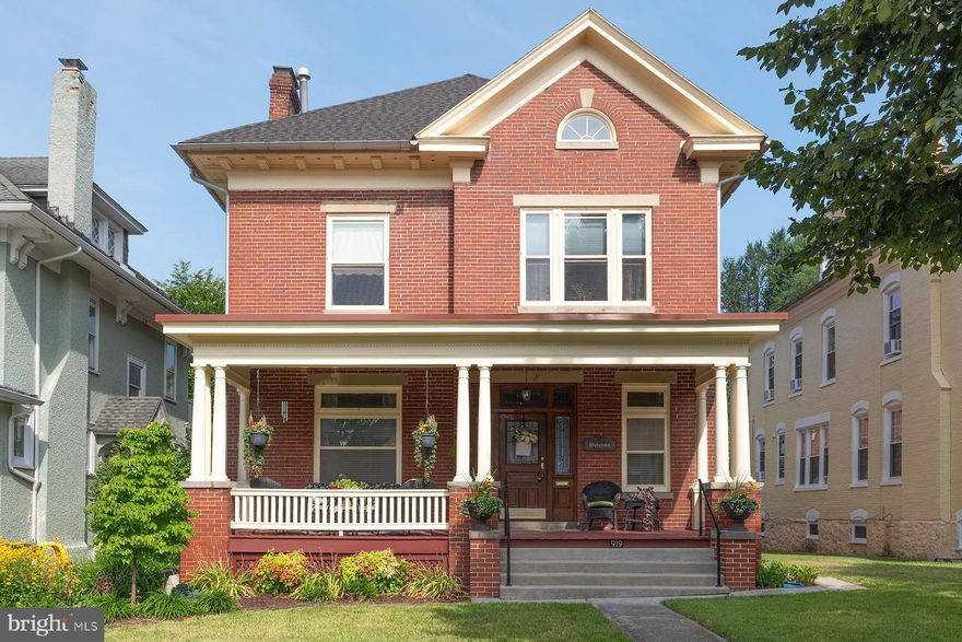 Welcome to this stunning brick colonial on the sought-after Oak Hill Ave! Impeccably maintained along with numerous upgrades!  With 5 bedrooms, 2 full and 1 half bathrooms, this traditional home offers a host of desirable features such as a finished attic,  3 fireplaces, central AC,  hardwood floors, spacious rooms, extensive moldings and high ceilings, landscaping, making it a perfect blend of elegance and functionality.   As you enter the home you'll be greeted by a grandiose entry / living room combination, suffused with natural light from ample windows and adorned with a beautiful marble fireplace. The formal dining room with bump-out, is an ideal space for entertaining guests. The gourmet kitchen boasts granite countertops, stainless steel appliances, exquisite custom cabinetry and back staircase. Adjoining the kitchen is a cozy den with custom floor to ceiling built-ins, a gas fireplace and ceiling fam, leading to a tiered deck with a lower-level stamped concrete patio and a beautifully landscaped backyard, perfect for outdoor relaxation and entertainment.  Enjoy the covered front porch!  Ascending the extra-wide staircases, you'll find the second floor with 4 bedrooms and 1 full bathroom. The laundry room, which could serve as a 6th bedroom, offers convenience and versatility. The hallway also includes a walk-in closet with custom built-ins, adding functionality to the living space. The finished third-floor attic is a gem, featuring a bedroom, gas fireplace, full bathroom, large storage area, and multiple windows, creating a comfortable and inviting retreat.  Completing this exceptional home is a large unfinished basement, ideal for additional storage,  workshop, utility room, with a walkout to the backyard. The detached oversized 1-car garage, accompanied by an additional paved parking area with alley access, ensures ample space for vehicles.  Located within walking distance of Gordon's Grocery, a local favorite, and with easy access to I-70, I-81, shopping, restaurants, and schools, this fantastic home offers convenience and accessibility.  Don't miss out on the opportunity to own this truly captivating property! Schedule your showing today!