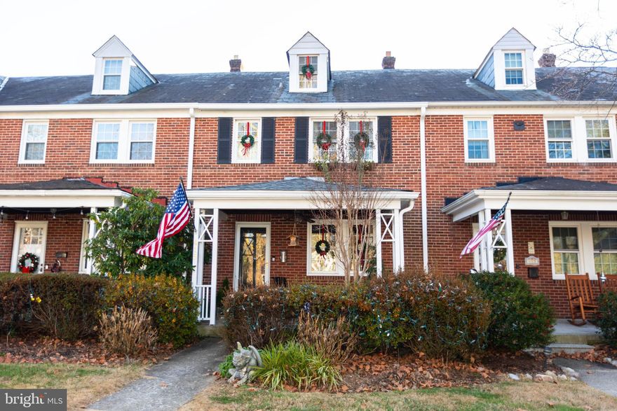 Welcome to this lovely true 4 bedroom townhome in sought after Rodgers Forge. From the moment you enter the house, you will enjoy the charm of original features such as hardwood floors, beautiful moldings and solid wood doors, while appreciating the updates that discerning buyers are looking for. Entertaining is a breeze both inside and out with spacious living and dining rooms and open concept kitchen. Remodeled in 2019, the kitchen features custom cabinetry, granite countertops and stainless steel appliances.  With south facing windows, natural light fills the rooms, creating a bright and airy feel. Step from the kitchen outside to the awning covered deck, or watch the world go by from the covered front porch. The lower level was completely remodeled in 2020, and features exposed stone wall, built in cabinets with custom wood top, recessed lighting and luxury vinyl plank floor and a full bath. There is abundant storage and a laundry room with door to exterior stairs. The second level features 3 bedrooms and full bath with vintage black and white tile. The real prize is the 3rd floor bedroom. A large double dormer and second single dormer create a light-filled tree top view sanctuary that can be used as a bedroom, office or artist’s studio. The detached garage can house a car or can be used for storage, yard tools or a workshop. 
Walk to Blue Ribbon Schools, The Charmery, hardware store, Starbucks...the walkability is off the charts. Tot Lot, Towson Rec sports, pickleball and tennis courts all around. This neighborhood has everything you need including lights across the Forge at Christmas. Rodgers Forge is community living at it's best.