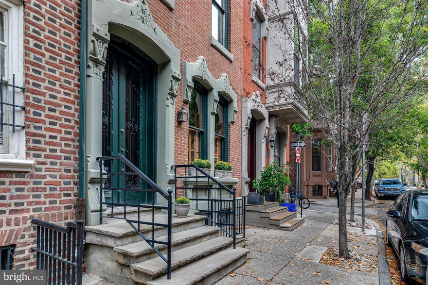 Fabulous  5 bedroom, 3.5 bath townhouse in the prestigious Rittenhouse Square area of Philadelphia. Custom features include original crown moldings, 5 fireplaces, hardwood floors, 2-zoned HVAC, stainless appliances-sub zero refrigerator, Miele dishwasher, commercial stove. Finished basement with full bathroom and separate entrance. Enjoy the spacious living spaces, high ceilings, abundant closets, huge bedrooms and large landscaped garden. Both the house and outdoor space are great for entertaining-from cocktail parties to large sit-down dinners.  This historic property has been meticulously maintained with recessed lighting throughout, coffered living/dining room ceiling,  intricate wood paneling, showcased by the grand winding staircase up to the 4th floor atrium, wonderful light-filled skylights and spectacular city views.
First floor, beautiful vestibule entrance with marble floor leads to open concept living/dining/kitchen, 1 fireplace, half bath.  Spectacular floor to ceiling bay in kitchen opens to romantic garden accented by large white Dogwood and white Crape Myrtle trees. Second floor, currently used as formal dining room, can function as an office/library/living room, 2 fireplaces, hallway with  Butler's pantry-Dumbwaiter/wet bar, sitting area and spacious great room overlooking the tree-lined street. Third floor features  2 large bedrooms, 2 more fireplaces, detailed crown molding,  magnificent tiled hall bathroom, laundry.  Fourth floor finishes the home with natural light atrium, 2 additional large bedrooms, decorative mantle and tiled hall bathroom with striking stained glass window accents.  Straight stairs to the finished basement can function as the fifth bedroom/au pair/office/playroom with full bathroom and separate entrance to the street.  Large storage room and mechanicals complete this floor. The unmatched premier location is steps from Rittenhouse/Fitler Square, local parks, restaurants/cafes, world class shopping, tennis courts, Schuylkill Banks trail, dog park, public transportation, 30th Street Station, major highways, University City and hospitals. One year prepaid parking at Rittenhouse area garage is included in the sale. A bonus 1-year basic HSA Home Warranty is included. Homestead Exemption eligible for new homebuyers.