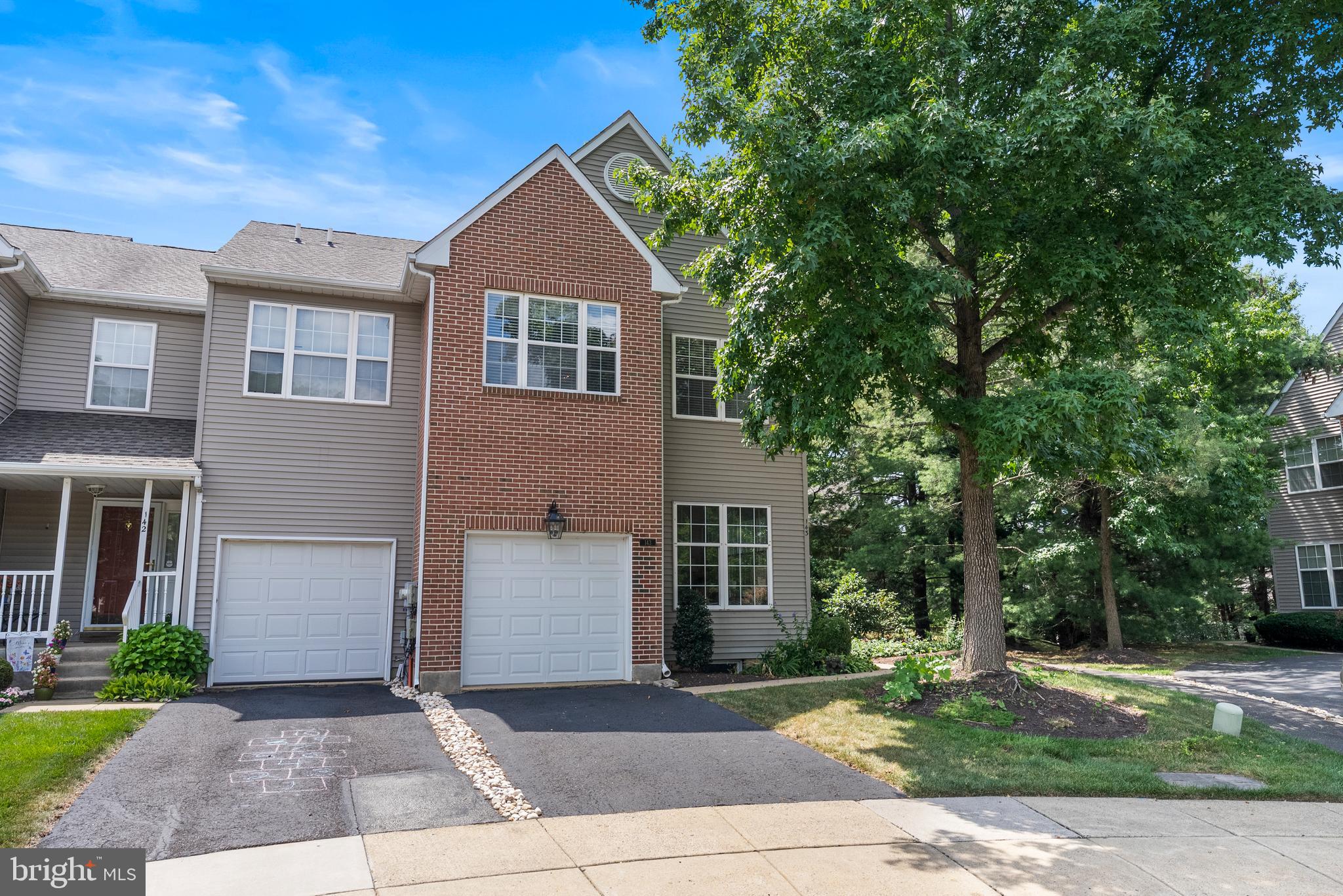 Welcome to this meticulous 3-bedroom, 2.5-bath end-unit townhome, located on a cul-de-sac in the desirable Charing Cross community. Lovingly maintained inside and out, this home is filled with natural light, upgraded finishes & fixtures, and beautiful garden landscaping that enhances its curb appeal. Step inside to a spacious, sun-drenched living room with an adjacent dining room opposite the foyer. The eat-in kitchen features granite countertops, ample cabinetry, newer appliances, and flows seamlessly into the open family room. Step out onto the charming deck to enjoy views of shade trees and a walking path; perfect for relaxing and enjoying your outdoor meals. Upstairs, the expansive primary suite offers vaulted ceilings, walk-in closet, and a luxurious ensuite bath with a soaking tub and separate walk-in shower. Two additional well-sized bedrooms, a newly remodeled hall bath, and convenient second-floor laundry complete the upper level. This home features a spacious one car garage, upgraded carpeting, lighting and newer laminate flooring in the foyer and kitchen. Located just minutes from the shops, dining, and vibrant culture of downtown Doylestown, this home combines comfort, style, and convenience in a beautiful, quiet setting. Don’t miss your chance to make this extraordinary home yours—schedule your private tour today! Homes in this special community do not last long! Showings begin at the OPEN HOUSE! Thursday, 8/14, 5-7pm.