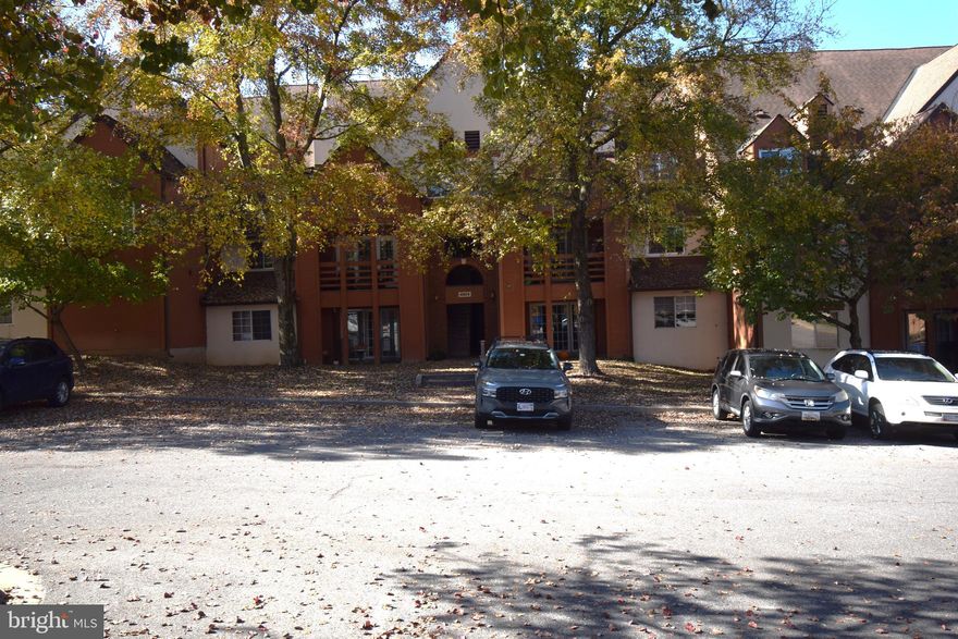 Beautiful top level condo backing to trees and the golf course! One of the best locations in the neighborhood! Fabulous bright two level condo with a big open living space, updated Kitchen and formal dining room on the main level. Doors to the balcony and the gorgeous view! The bedrooms and bathrooms are updated and  tucked away upstairs. Full size washer and dryer in the unit! Gorgeous community close to shopping and commuter routes.