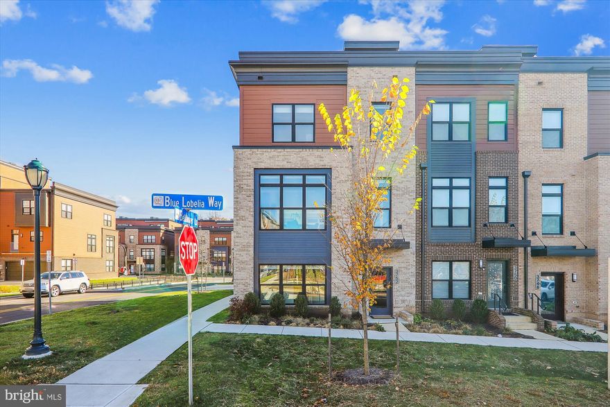 IMPROVED PRICE! Experience luxury living at its finest in the highly sought after Carter end unit model in Tower Oaks. A masterfully crafted residence by EYA, this residence offers an ideal blend of elegance and functionality. An expansive layout with 5 bedrooms, 4.5 bathrooms, and the added convenience of an elevator servicing all levels, this home sets the standard for luxury living. 
The first level of this home provides flexibility to suit your lifestyle with a versatile space that can serve as a functional office or bedroom with an ensuite full bathroom. Additionally, a convenient two-car garage is perfectly integrated into this level, ensuring ease of access and secure parking. Notably, the immediate access to an elevator eliminates the necessity for stairs entirely, enhancing the overall convenience and inclusivity of the home’s design. 
As you step into the main living area, a symphony of natural light bathes the space, accentuating the 9’6” ceilings that amplify the openness of space seamlessly connecting the kitchen, dining area and the great room. Tucked away on this level is a discreet powder room adding to the functional elegance of the space. The deluxe kitchen is a culinary dream, featuring  premium appliances, under cabinet lighting, quartz countertops, and exquisite upgraded cabinetry. The great room is adorned with a stunning linear fireplace complimented by back-lit built-in bookcases and an accessible deck for grilling and relaxation. An advanced automation system controls audio, video and window shades on this level and in the primary bedroom suite.
The third level of the home unfolds to reveal a sanctuary of comfort. The primary suite beckons with 2 spacious walk-in closets, a wall safe and a spa bath that exudes relaxation complete with a glass walk-in shower, lighted mirror, comfort height water closet bowls, with dual flush and quartz countertops. Two more bedrooms, a full bathroom and the laundry complete the practicality of this level. 
Ascend to the fourth level  a versatile space that can serve as a fifth bedroom with a full bathroom, a second family room or an inspiring office. This level opens up to a private roof deck, featuring Floor Tech flooring and pre-wiring for a TV, creating an idyllic retreat for relaxation or entertainment. 
Throughout this home, discover additional upgrades such as hardwood flooring, automated window shades, and contemporary base moldings. The integration of the energy- efficient features and surround sound on the main level and primary suite enhances both comfort and functionality. 

Beyond the confines of this extraordinary residence, conveniently located steps from your new front door, lies the heart of the community known as CORE. Tower Oaks was voted by Bethesda Magazine as the “Best Townhome Community of 2022”, by Bethesda Magazine The CORE is a hub of premium amenities including a state of the art fitness center, yoga room, Amazon Hub, resident cafe/lounge, activity room, club room, an outdoor oasis with a pool, lounge areas, barbeque grills, firepits, tot lot, green space and sport court. Tower Oaks offers not just a home but an unparalleled lifestyle where luxury, convenience and community converge.