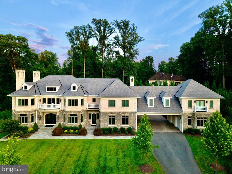 Discover the epitome of luxury and elegance at 1039 Aziza Court, a magnificent estate located in the prestigious area of Great Falls. This stunning property, set on approximately 2 acres of beautifully landscaped grounds, offers an almost 15,000 Sq Ft seamless blend of timeless design and masterful craftsmanship, perfect for those seeking a sophisticated lifestyle.
GRAND INTERIORS:
Upon entering this luxurious home, you are welcomed by a sweeping foyer featuring 2 grand crystal chandeliers. The soaring ceilings adorned with intricate crown molding add to the home's sophistication and grandeur. 
GOURMET KITCHEN HAVEN:
The state-of-the-art gourmet kitchen is designed for culinary enthusiasts. It boasts a 60-inch Wolf Range with double ovens, a griddle, and a pot filler water tap. The kitchen is equipped with two hammered copper farm sinks, two Miele dishwashers, and a built-in microwave, offering ample space for multiple chefs to work simultaneously. Custom cabinets and a smart layout make culinary experiences both easy and delightful.
LUXURY PRIMARY SUITE SANCTUARY:
Retreat to the tranquility of the primary suite, a private haven featuring a generous seating area, a cozy two-sided fireplace, and a retreat kitchen area with refrigerator. The lavish ensuite bathroom is designed for ultimate relaxation, with heated marble floors, a two-person spa, Kohler steam shower, and separate his-and-her sink areas. Step onto the private terrace off of the master suite to enjoy stunning views of the tranquil lush gardens.
OUTDOOR PARADISE
Experience the ultimate outdoor paradise with four fireplaces, a pizza oven in the outdoor kitchen, and an Olympic-sized pool with a bubbling spa. The outdoor area is perfect for alfresco dining and entertaining year-round. Enjoy the basketball court, which easily converts to a pickleball court, and a beautifully landscaped garden with 31 point irrigation and lighting systems.
MODERN CONVENIENCES
This smart home is equipped with "Savant," allowing you to control lighting, TV, music, indoor gas fireplaces and shades effortlessly. A Tesla charger is available, and state-of-the-art exterior infrared camera security system features provide peace of mind. The full house generator ensures uninterrupted comfort and convenience no matter the weather or circumstance.
Community and Neighborhood

Great Falls offers charm, exclusivity, and top-tier amenities logistically situated in the heart of Northern Virginia and 30 minutes from Georgetown, DC. Located within the renowned Langley High School district, known for its academic excellence, this property combines serenity with access to Northern Virginia's vibrant community and resources.