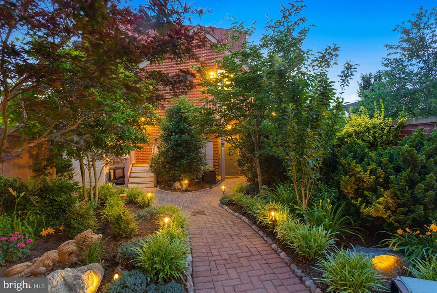 Luxury living at its finest!! This Executive style corner lot townhome has THE MOST impressive and largest rear yard in the entire community w/unobstructed park views!  Boasting nearly 4,000 sq ft of modern finishes at every turn: 5 bedrooms, 3.5 baths, w/detached 2 car garage w/in-law suite above, has an open floorplan consisting of 10-foot ceilings, built-in surround sound on every level, 40 sq ft center kitchen island, upgraded SS appliance package w/ 6 burner gas range, 3 ovens, chef sink &  beverage cooler in island, not to mention tons of prep space across the black obsidian counters! Enjoy sun-drenched rooms on every level with the multitude of additional windows, and bump outs,  found on this prime corner lot!  The  primary suite upstairs spans 19’x23’ w/bump out (great sitting area) , easily fits your California King bed and oversized furniture! Two deeply set closets w/custom built-ins pave the way to your spa-like ensuite which offers dual vanities, private commode, linen cabinet, frameless glass shower, and spa-like soaking tub- all features only found in this 24’ extra wide layout!  Across from the primary is the secondary bedroom that could be used as a nursery, home office, or home gym!  Bring Super Bowl Sunday to life in the 3rd floor family room. Here you have ample space to host large gatherings, keep your drinks cools in the beverage cooler w/wet bar,  or enjoy the amazing DC firework displays all and monument views all from the privacy of your gorgeous home! 
Access your phenomenal outdoor space in the rear yard located just off the kitchen, and you’ll find Professional landscape architects created one amazing  backyard oasis, w/over $60k in hardscape upgrades! Lush landscaping w/trees and shrubs provide additional privacy, plenty of area for gardening, soaker watering system, illuminated brick paths  pave the way to your oversized detached 2 car garage/carriage house!  Not only does the carriage house provide you w/an additional 400 sq ft of living space above the garage, but it also is equipped with kitchenette set up w/beverage cooler, full bath, bamboo floors, built-in surround sound, walls lined w/windows, and a separate hot water heater and HVAC unit specifically designated for this space alone! NEW HVAC in Studio as of Sept 2022! This highly versatile space above the garage could easily serve as a great in-law suite, home office, or home gym! Added bonus – your guests can enter the rear patio & studio living area via the side patio gate vs the garage, just another perk of this corner/end lot! 
 Whether you seek turn-key luxury inside, or a multitude of entertainment areas outside, you’ve found yourself the one home that truly checks all the boxes! Potomac Yard is considered one of the best places to live because it affords the neighborhood feel, yet walkable to your favorite restaurants/shops/parks in Del Ray, & if all goes as planned by Spring this year you will also be able to walk to the Potomac Yard Metro Station (blue/yellow lines)! If driving is more your jam, less than 10 minutes  to Old Town Alexandria or Reagan National Airport. 2 miles north the Amazon HQ2 construction is well underway with expectations to complete phase 1 of their two office buildings and 50,000 sq ft of retail space in 2023. If this weren’t enough to quench your thirst for your best investment ever made, Virginia Tech’s Innovation Campus is gradually making its home on 3.5 acres of new mixed-use space adjacent to the future Potomac Yard Metro station in 2024! The steady growth of home values in Potomac Yard will continue to thrive, despite the market conditions elsewhere, especially now that these community transformations are within arm’s reach! So, make the right decision to call 2114 Potomac Ave “Home” today, and avoid feelings of immense remorse & regret of not doing so later! You will be SO glad you did!