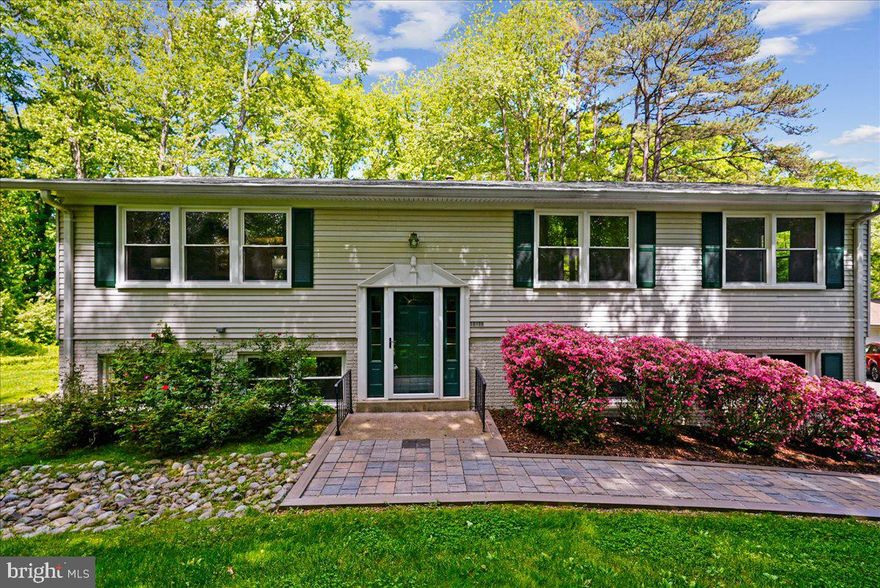 RENOVATED AND TRULY MOVE-IN READY! FOLLOW THE PAVER WALKWAY TO THE FRONT DOOR AND STEP INSIDE ONTO BEAUTIFUL HARDWOOD FLOORS THAT SET THE TONE FOR THE HOME.  UPSTAIRS, THE MAIN LEVEL WELCOMES YOU WITH A SUN FILLED LIVING ROOM FEATURING RECESSED LIGHTING, AN INVITING SPACE PERFECT FOR BOTH EVERYDAY LIVING AND ENTERTAINING. THE GOURMET EAT-IN KITCHEN IS SURE TO IMPRESS, OFFERING AMPLE CABINETRY WITH UNDER-CABINET LIGHTING, A CUSTOM TILE BACKSPLASH, AND GRANITE COUNTERTOPS THAT PROVIDE BOTH STYLE AND FUNCTIONALITY.  FROM THE KITCHEN, STEP OUT ONTO THE EXPANSIVE DECK OVERLOOKING MATURE TREES, AN IDEAL SETTING FOR GRILLING, DINING AL FRESCO, OR SIMPLY ENJOYING THE OUTDOORS. STAIRS LEAD DOWN TO THE LARGE REAR YARD, PROVIDING EVEN MORE SPACE TO RELAX OR ENTERTAIN.  BACK INSIDE, THE MAIN LEVEL CONTINUES WITH THE PRIMARY SUITE, COMPLETE WITH NEUTRAL CARPETING, A CUSTOM CLOSET, AND A RENOVATED EN SUITE BATH FEATURING TILE FLOORS, A WALK-IN SHOWER WITH CUSTOM TILE, AND AN UPGRADED VANITY. TWO ADDITIONAL BEDROOMS, ALSO WITH NEUTRAL CARPETING, SHARE A RENOVATED HALL BATH WITH TILE FLOORS, A TUB/SHOWER COMBINATION, AND UPDATED VANITY.  THE LOWER LEVEL OFFERS A SPACIOUS REC ROOM—PERFECT FOR GATHERING WITH FRIENDS, MOVIE NIGHTS, OR WATCHING THE BIG GAME. A SLIDING GLASS DOOR PROVIDES DIRECT ACCESS TO THE REAR YARD, CREATING A SEAMLESS INDOOR, OUTDOOR FLOW.
THIS LEVEL ALSO FEATURES A CONVENIENT LAUNDRY AREA WITH A FRONT-LOADING WASHER AND DRYER, A UTILITY SINK, AND A WORKSHOP SPACE—IDEAL FOR HOME PROJECTS OR ADDITIONAL STORAGE.  THIS HOME CHECKS ALL THE BOXES—STYLE, SPACE, AND FUNCTION. ABSOLUTELY A MUST SEE!