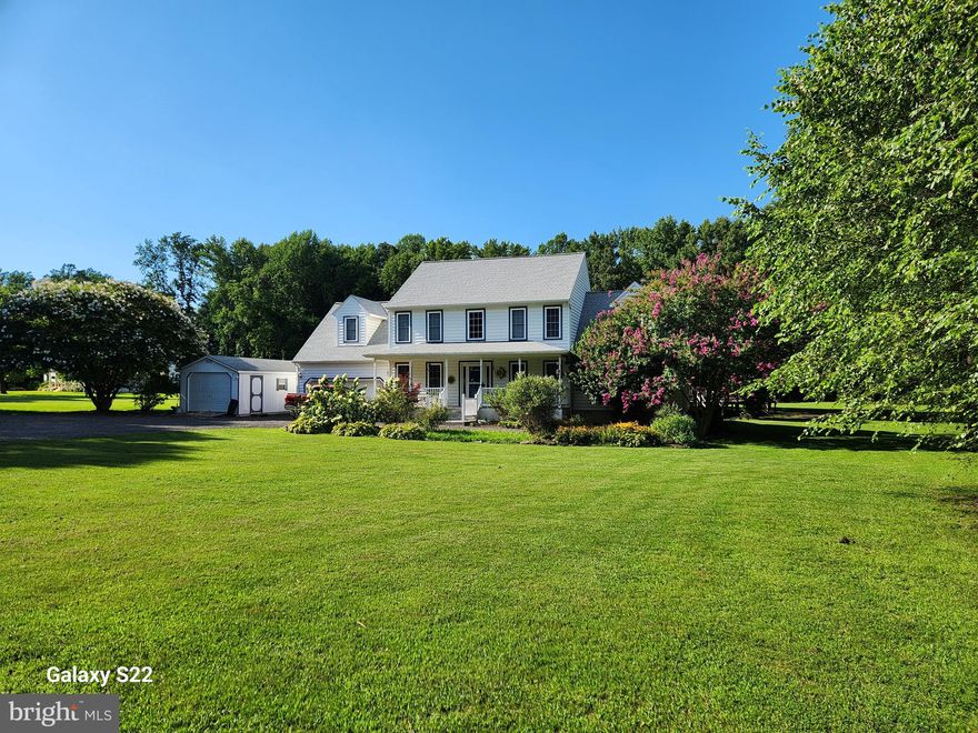 Lovely grand colonial with covered front porch located on almost 4 acres. The first floor  offers a  huge primary suite with walk in closet and bath with soaking tub, dual headed shower and double vanity.
Dining room has gleaming hardwood floors with enough space to seat 20 people, lovely overhead chandelier and warming propane fireplace . Kitchen has all stainless appliances, plenty of workspace, under cabinet lightning. tile backsplash and pantry. Kitchen also has a separate eating area that offers a more informal setting. Family room offers another propane fireplace plus plenty of room for your family gatherings. Laundry room  has a separate pantry area with tons of storage and room for second fridge and freezer plus a laundry tub and hanging area. A  great office with hardwood floors for the person who works from home. The second floor has three bedrooms( one converted to kitchenette) plus two large bonus rooms and full bath. The outside space is a private oasis with a 30 x 12 screened porch and a 67 x 40       
deck for family gatherings . Recent upgrades include Geo thermal  heating and air conditioning system(2017) and new roof (2023). 12x24 shed with electric for plenty of storage. Come visit and make this your new home.