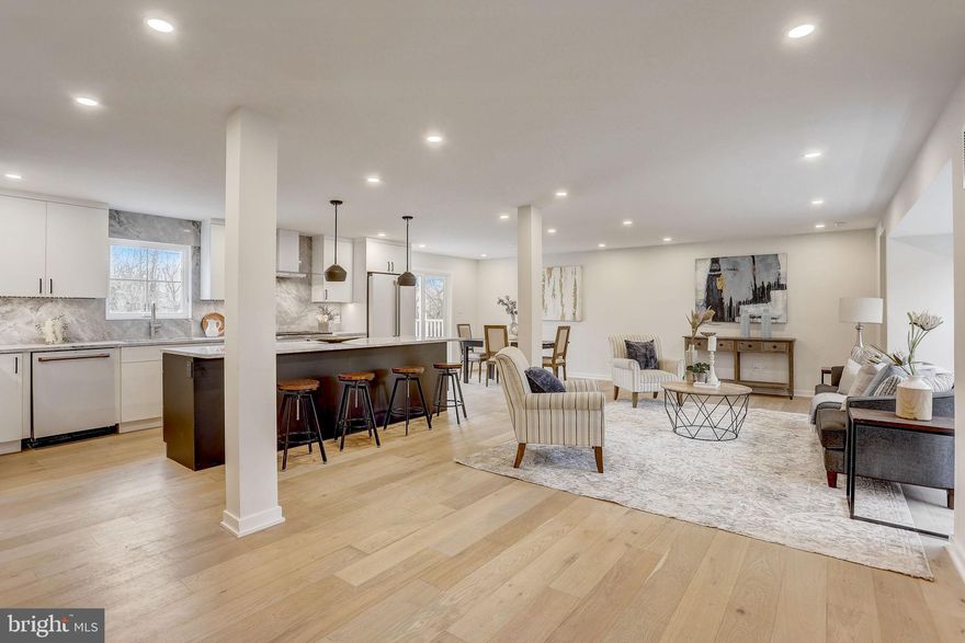 This luxury home in Gladwyne has been immaculately renovated.  Located  within the Lower Merion Township School District in close proximity to Center City, Suburban Square and tons of amenities. Meticulously crafted by the builder, no expense was spared in transforming this home into a showcase of contemporary elegance. The home includes 5 bedrooms, 3.5 bathrooms, 2 car garage and an expansive deck that runs the entire rear of the home.  On the exterior, the builder spared no expense with new Pella windows throughout, a new roof and Hardie board siding.  Approaching the entrance, a welcoming covered front porch beckons, providing an idyllic space to savor the outdoors. Step inside to discover an open-concept first floor where living, dining, and kitchen spaces harmoniously converge. Abundant natural light cascades through massive windows and a sliding door, highlighting the meticulously designed interiors. The fully redesigned kitchen will have a gigantic island, floor to ceiling pantry and top notch finished.  Including GE cafe appliances, super white quartz countertops and a massive island with seating for four.  Through the kitchen you'll find the bonus den with access to the powder room and another massive slider to provide access to your rear deck.  As you head upstairs you'll quickly notice the extra high ceilings.  The builder raised the original homes ceiling height to provide larger rooms allow for a more modern feel.  The new hall skylight provides additional light for the upstairs laundry closet and the 5 bedrooms and 3 full bathrooms allow you to have a multitude of living options.  The fully redesigned primary suite has two exposures, a walk in closet to die for and a primary bathroom with double vanity, shower and separate soaking tub. The primary bath has heated floors and expensive windows facing the front of the home. The lower level features a mud room with cubbies, heated floors and provides direct access from the two car garage into the home. Located in Gladwyne within the Lower Merion School District.  This home provides easy access to Center City Philadelphia, Suburban Square and is within minutes of shopping, restaurants and parks.   ***Please note that the seller is in the process of repaving the driveway and finishing the exterior.  They will be seeding for grass, moving the boulders in the rear yard and adding abbreviates along the rear of the property line***