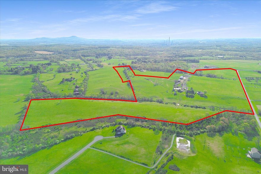Here is your chance to own a gorgeous working farm only minutes from downtown Leesburg.  The property features rolling hills, beautiful views of the Catoctin Mountains, open pastures, creeks, fencing for livestock, run-in sheds, a large shop, and a big equipment shed.  Multiple pastures with high tension and board fencing.  Plus field waters and open fields, great for making hay.  The 1890s farm house is waiting for your finishing touch, but has an updated kitchen, updated primary bathroom & bedroom. Recently installed laminated floors and freshly painted.  Large family room, formal living room, front porch, and large deck.   In addition, the property features multiple wells and perk sites and can be divided into three total lots.  Located on hard surface roads and with additional access off Chapel Lane.  The property is in a conservation easement with Old Dominion Land Trust.  Information regarding the easement is located in the documents section.