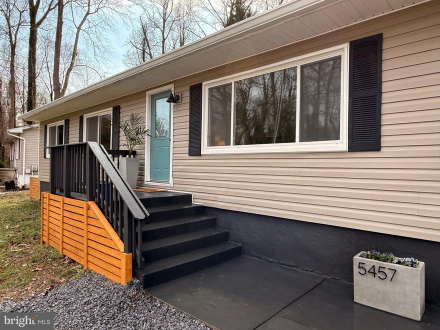 The beach is calling! Step into this charming 3-bedroom, 1-bath home at 5457 Bayview Ave, St. Leonard, MD, completely renovated in a boho-organic modern style. This beachside sanctuary features new LVP floors, a fresh kitchen with butcher block counters, gold hardware/fixtures & new appliances, a luxurious retreat-style bath with sage green custom tile, large vanity & gold accents, new architectural shingle roof, and new hot water heater. Enjoy the refreshed gravel driveway and fully fenced backyard - perfect for furry friends. Store the kayaks and bikes in the large back shed (as-is). New septic in 2016. Just steps to the Chesapeake Bay community beach for sand-beneath-your-toes vibes, plus a nearby marina/boat ramp for easy water adventures. Low $70 annual civic association fee + a one-time $17 key fee for secure beach and boat ramp parking access (fees subject to change; details at community site). Qualifies for USDA loan - no money down for qualified buyers! Don't miss this boho-beachy paradise!