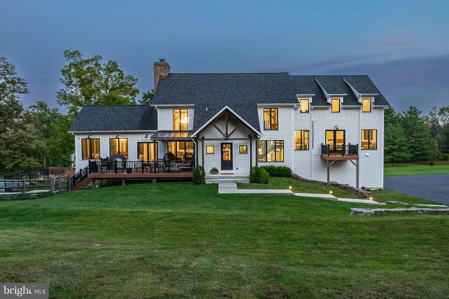 Serendipity Acres       Bordering a serene township park, Serendipity Acres encompasses 5.2 acres in the heart of coveted Saucon Valley. The dramatic three-story 2018 barn home by Erwin Forrest Builders features an open floor plan punctuated by soaring ceilings and walls of windows framed in antique hand-hewn barn beams. The heart of the home is the masterfully crafted gourmet kitchen with a massive island, quartz counters, high-end appliances and walk-in pantry. A breathtaking stone floor-to-two-story-ceiling fireplace anchors the kitchen, dining and great rooms. The adjoining family room, with vaulted beamed ceilings, hardwood floors, and walls of windows, provides both warmth and architectural drama.

      The primary suite occupies its own level with spa-inspired bath, enviable walk-in closet, and a secluded deck. Three additional bedrooms and three baths will amply accommodate. Pointed stone walls and barn beams on the lower level attest to the home’s heritage. On the lower level, original stone walls and exposed beams highlight the home’s heritage, while a versatile multi-purpose room with garden access lends itself beautifully to a home theater, fitness studio, or creative space.
      
      Designed with multi-generational living and hospitality in mind, the detached carriage house features luxury finishes, including granite countertops and radiant heated floors. Garaging includes a heated three-car garage and additional oversized garage with loft storage. Outdoors, the property is a sanctuary for recreation and relaxation, featuring a 2020 saltwater pool, built-in ground-level trampoline, and expansive lawns. Smart home technology, ultra-efficient utilities, and maintenance-free Hardie plank siding ensure ease of living.