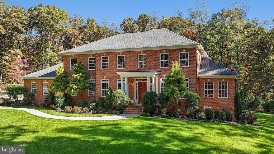 Set on five private acres surrounded by mature trees and located near both the historic Chancellorsville Battlefield and the Rappahannock River, this exceptional custom all-brick residence offers nearly 9,000 square feet of thoughtfully designed living space across three finished levels. Built in 2011, this home combines timeless craftsmanship with modern luxury, creating an ideal setting for both grand entertaining and comfortable everyday living.
The main level welcomes you with 10-foot ceilings and stunning Brazilian Cherry flooring, creating a warm and elegant backdrop throughout the living spaces. The open floor plan provides seamless flow between rooms while still offering distinct areas for gathering or quiet retreat. At the heart of the home is the well-appointed kitchen, featuring Quartz countertops, a spacious center island, two dishwashers, stainless steel appliances, a pot filler, custom cabinetry, and a tile backsplash. A breakfast bar connects the kitchen to the dining area, while the adjacent family room offers a gas fireplace and inviting space to relax.
A main-level bedroom suite with private sitting room and full bath provides excellent flexibility for guests, extended stays, or multi-generational living. The side-loading three-car garage complements the home’s architectural appeal while providing ample parking and storage.
Two staircases access the upper level. Each of the four upper level bedrooms feature their own private full bath, providing comfort and privacy. The expansive primary suite serves as a luxurious retreat with a spacious bath and two walk-in closets. A large upper-level laundry room adds convenience and functionality.
The walk-out lower level is designed for recreation, creativity, and productivity. This level includes a rec room, game room with a two-sided fireplace, media area, kitchenette, art room, bonus room, large office, and full bath—creating endless possibilities for entertainment, hobbies, or work-from-home needs.
Surrounded by natural beauty and offering exceptional space, craftsmanship, and versatility, this remarkable residence presents a rare opportunity to own a private retreat in a historically significant and highly desirable location.
Some additional features that may be unseen while touring include: wiring and plumbing for a future central vacuum system; wiring and natural gas plumbing for a future generator; natural gas plumbing for a future pool heater; a 240 volt plug in the garage; a constant pressure system for the well; spray foam insulation in the conditioned attic.