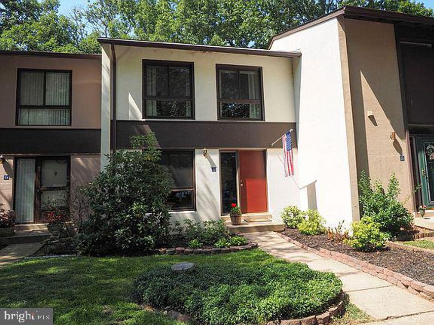 Beautiful updated townhouse with Master Bath.  Gorgeous mahogany Hardwood Floors, Crown Moulding and Chair Raling throught the main level.  Top shelf kitchen with Stainless Steel appliances, St. Cecelia granite and porcelain floor tiles. 3 real Bedrooms and  3 Full Baths.  Lower Level Family Room can be a 4th bedroom if needed.  Walk-Out Basement with a Large Deck backing to trees. 2 Assigned Parking Spaces right out the front door.  Within a 1 Mile drive to the Reston Whiele Metro.   This is Reston at its Best!  Come and see because this home will not last long!