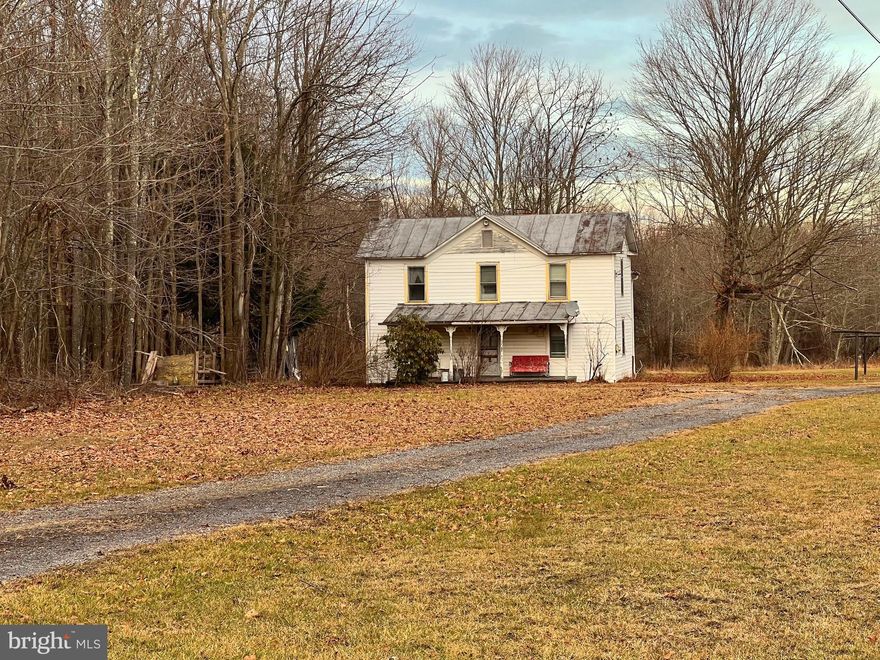 A mixture of woods and open, this 2.69 acre farmette has great gardening space and room for your laying hens and a couple of goats!! Situate just off Union Highway,  the 100 + year old, 1520 square foot farmhouse needs some TLC,  hasn't been lived in for several years, but is livable! Has approved septic, public water, electric. Needs a good clean out and appliances installed.  This beautiful, unrestricted lot would be a perfect build site or RV location for nearby lake recreation or for a power plant worker! Twenty minutes to Davis and Thomas for biking, hiking, skiing enjoyment. Great investment! Must have  lender pre-qualification letter for conventional loan or proof of funds for showings!