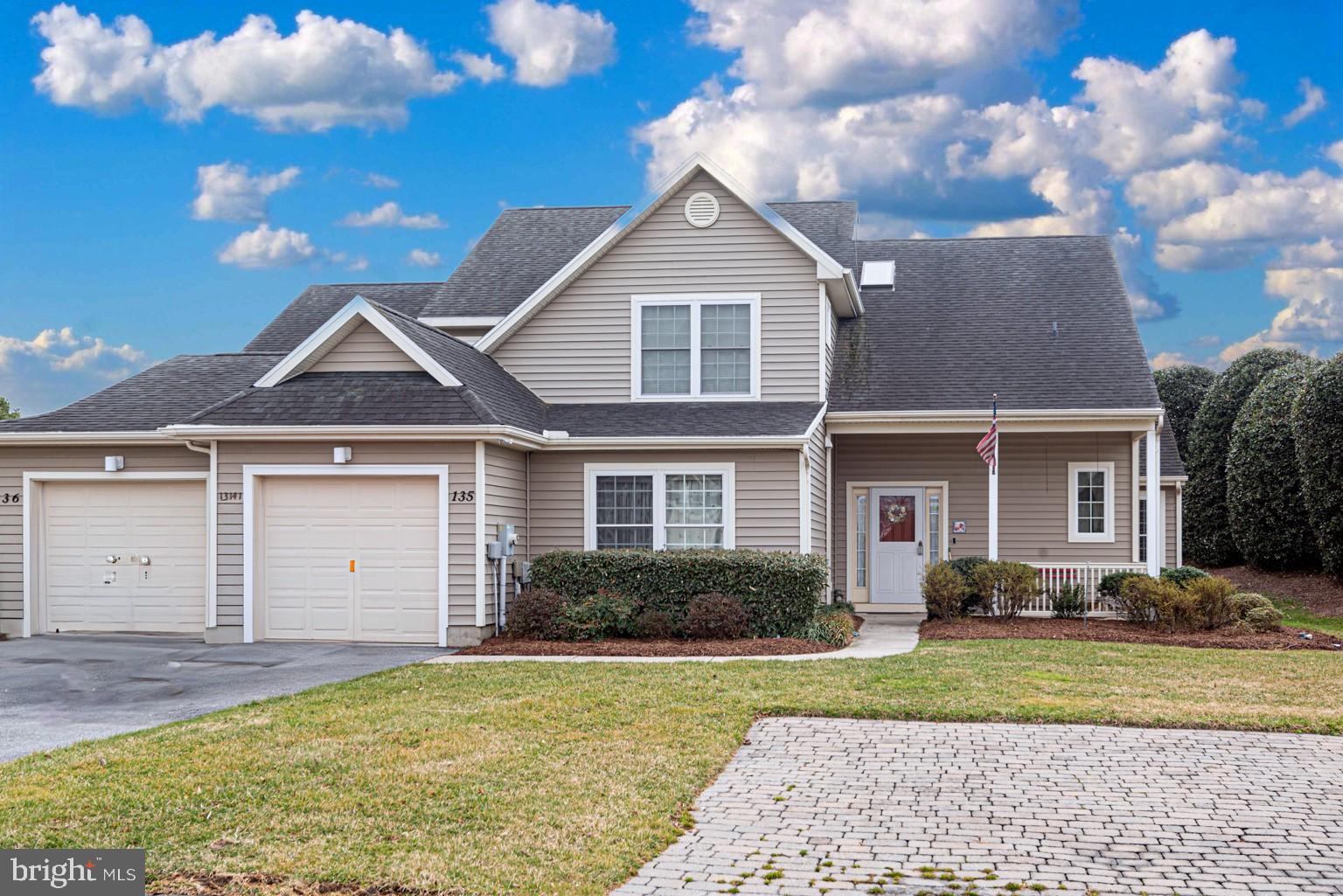 This well-maintained villa-style townhome is nestled in the sought-after waterfront golf course community of River Run. Featuring a spacious layout with 4 bedrooms and 3 bathrooms, this charming home boasts a screened porch and is part of a small, private group of two villas, offering a peaceful and secluded backyard. The home provides ample parking, including a detached garage, paved driveway, and designated overflow parking for convenience. Outdoor living is a highlight, with both a front porch and rear screened porch expanding the home’s space for relaxation or entertaining. Inside, the gourmet kitchen is a chef’s dream, with solid wood 48-inch cabinets, granite countertops, stainless steel appliances, and a cozy breakfast nook. The open-concept living room features soaring cathedral ceilings and a gas fireplace, creating a warm and inviting atmosphere. The first-floor master suite is a true retreat, featuring a king-sized bed, crown molding, upgraded carpet, walk-in closet, and an ensuite bath with luxurious finishes. An additional bedroom and full bathroom on the first floor provide flexibility for guests or use as an office. Upstairs, two more bedrooms share a private deck, perfect for enjoying the serene surroundings. Located within the River Run community, residents have access to a range of exclusive amenities, including community boat slips, a restaurant, clubhouse, event venue, pool, fitness center, tennis courts, and a community center. Plus, with the iconic Ocean City beaches just a 14-minute drive away, this home offers the perfect blend of relaxation and recreation, making it ideal for both full-time living and vacation getaways.