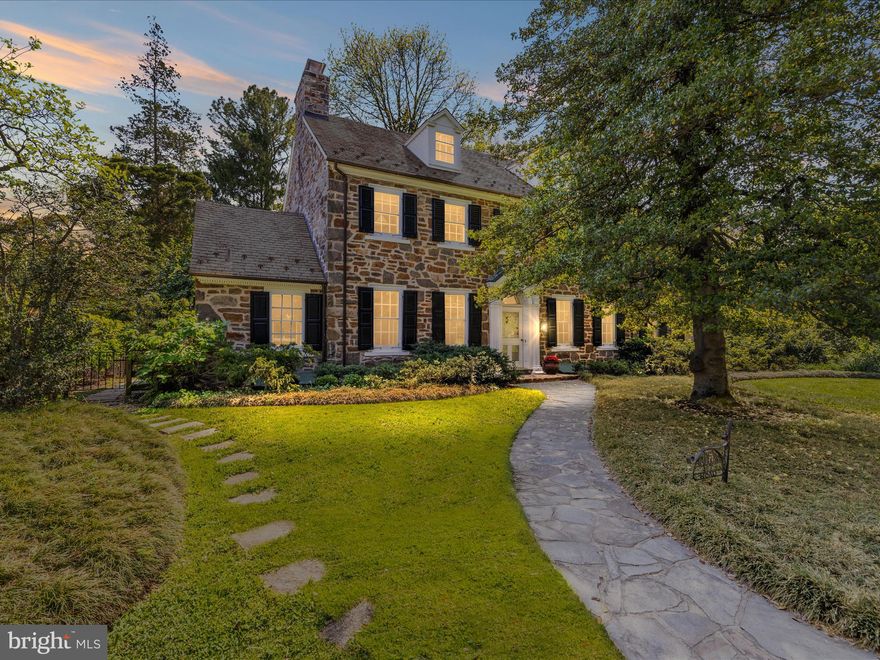 ALL OFFERS DUE BY 4PM MONDAY, MAY 5. Stately stone Colonial with the inherent charm of a country manor on prime block in historic Homeland lovingly cared for by longtime owners. Gorgeous wood floors and custom built-ins throughout, foyer entry, living room with gas fireplace, formal dining room with wood-burning fireplace, eat-in galley kitchen with ergonomic cork flooring, exposed stone wall, skylight, half-bathroom, and first-floor den /office with built-in bookcase and gas fireplace. Grand stairwell leads to second floor, where the spacious Primary Suite awaits at the end of the window-lined hallway. On the opposite side of the hall are two additional large bedrooms and a full bathroom. A fourth bedroom, third full bathroom and bonus room/office are on the third floor. The partially finished Lower Level has a rec room, half-bathroom, and laundry room. The fenced backyard sanctuary boasts an expansive stone patio with pergola overlooking garden beds and play yard. Private driveway leads to attached two-car garage. Fireplaces are conveyed As Is.