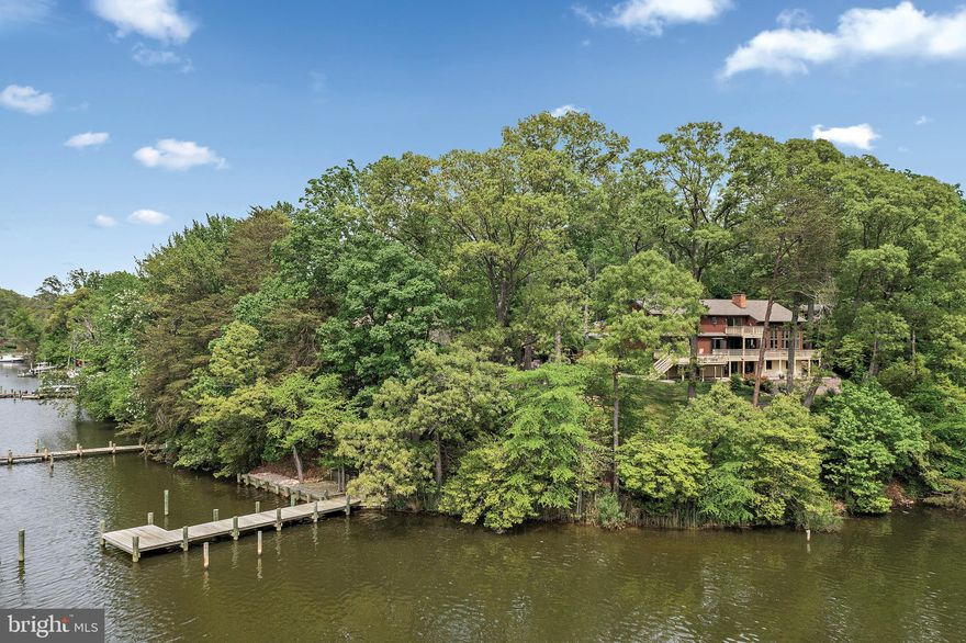 Discover coastal living at its best at 181 Doncaster Road, waterfront residence nestled in the picturesque community of Twin Harbors on Dividing Creek. This extremely well-maintained home features a deep-water private pier (5 ft MLW) and landing, completely rebuilt in 2020, perfect for boating enthusiasts. The spacious waterfront deck, replaced in 2022, offers an ideal space for entertaining, with fabulous water views from nearly every room. As you approach the property, you are  greeted by beautifully landscaped gardens, specimen trees, and a private driveway leading to a welcoming entrance. 
The south facing home boasts an open-concept floor plan designed to maximize natural light and showcase the waterfront setting. Inside, high ceilings, hardwood floors, and recently replaced sliding glass doors and picture windows frame the stunning water views, creating a bright and airy atmosphere throughout.
The spacious eat-in  kitchen is perfect for everyday meals or hosting guests. The master suite serves as a private retreat, complete with an en-suite bathroom, walk-in closet, and great water views. The additional 3 bedrooms on the upper level are thoughtfully designed to provide comfort and privacy for family and guests alike. Walk out lower level with 5th bedroom, full bath, fireplace insert offers fleible space for guests, games and entertaining. 
Additional features include a two car garage, an elevator to all three floors, spacious fenced rear yard. Recent improvements include a 3 year old roof,  exterior paint, carpet, hot water heater and A/C unit.
 Beyond the dock, enjoy the convenience of local amenities, including a private beach, boat ramp, and picnic areas, all enhancing the Twin Harbors lifestyle.