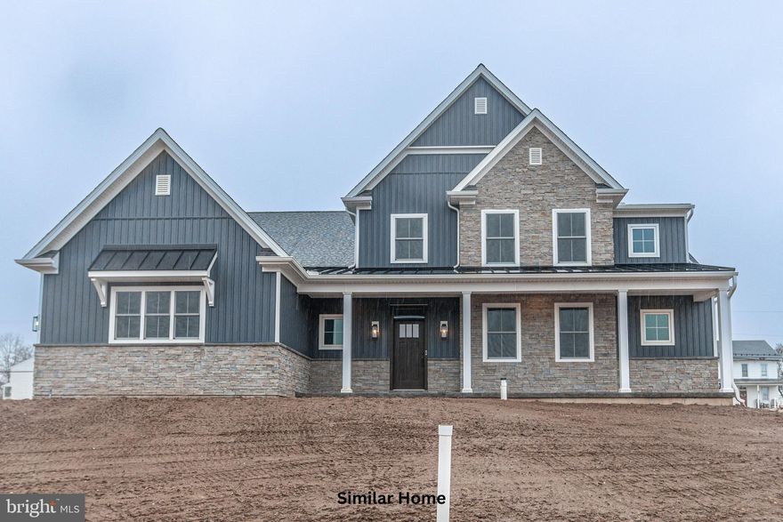 Discover the opportunity to build the stunning Garrison plan on a spacious half-acre-plus homesite in the prestigious Addington Reserve community, located within the highly sought-after Central York School District. This thoughtfully designed two-story home with a first-floor owner’s suite offers 3,136 square feet of beautifully crafted living space, including 4 bedrooms, 3.5 baths, and a generously sized 2-car side-load garage with an additional storage bay. Construction will be expertly managed by Phil Carpenter Custom Homes, one of the region’s premier custom builders known for quality craftsmanship and attention to detail.

The main level features a private owner’s retreat designed for comfort and relaxation, complete with a luxurious spa-inspired ensuite that includes a soaking tub, an expansive walk-in shower, and direct access to a large walk-in closet for exceptional convenience. The heart of the home is a chef’s kitchen outfitted with a grand center island, granite countertops, and a walk-in pantry, all flowing seamlessly into the open dining area and great room—perfect for both entertaining and everyday living. A versatile flex room on the first floor provides the ideal space for a home office, den, or hobby area.

Upstairs, you’ll find two bedrooms connected by a Jack and Jill bathroom with dual sink vanity, a spacious loft adaptable to your lifestyle needs, a conveniently located laundry room, and a fourth bedroom with access to its own nearby full bath. An optional main-floor laundry room is available for added ease and functionality.

Elegant high-end finishes enhance the home’s curb appeal, including striking stone masonry, stylish board-and-batten accents, and a welcoming full-length front porch. Buyers are encouraged to inquire about available incentives when using the builder’s preferred lender and title company. Additional home plans are also available to suit a variety of preferences. Don’t miss your chance to build in this exclusive community—only four homesites remain.