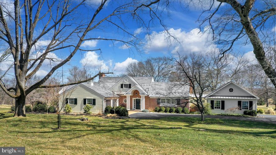 Abundant curb appeal, stylish amenities and a breathtaking 2015 renovation create a unique residence of old and new …. combining space, light and imagination.  At the end of a private road in White Acre, on 4+ acres, this timeless design has been updated to current expectations without compromising character. This Saucon Valley property is a classic example of the skill, craftsmanship and quality one would expect of its era, stunningly updated, with panache, by the current owners. The floor plan creates a spacious, airy, light-filled home that makes one feel connected to the environs. Boldly open, yet delivering intimate warmth, the main floor flows between spacious and inviting rooms. A gorgeous sunroom, with an expansive wall of windows, opens to a stone patio and outside kitchen, perfect for alfresco dining. The elegant living and dining rooms lead to other gracious rooms.   As one would expect from a residence of this caliber, there is a breathtaking 2015 kitchen with wet bar, soap stone and quartzite countertops and high-end appliances, connecting to a sunken family room with cherry floors, custom built-ins and fireplace. Completing the first floor is a sophisticated primary bedroom, with luxurious bath and master closet addition, and a mud room and laundry room.  On the second floor, 3 bedrooms, an office and two baths provide space for family and friends.  A lower level gym offers a multi-option space.  Finally, the 4-car garaging is guaranteed to impress.
