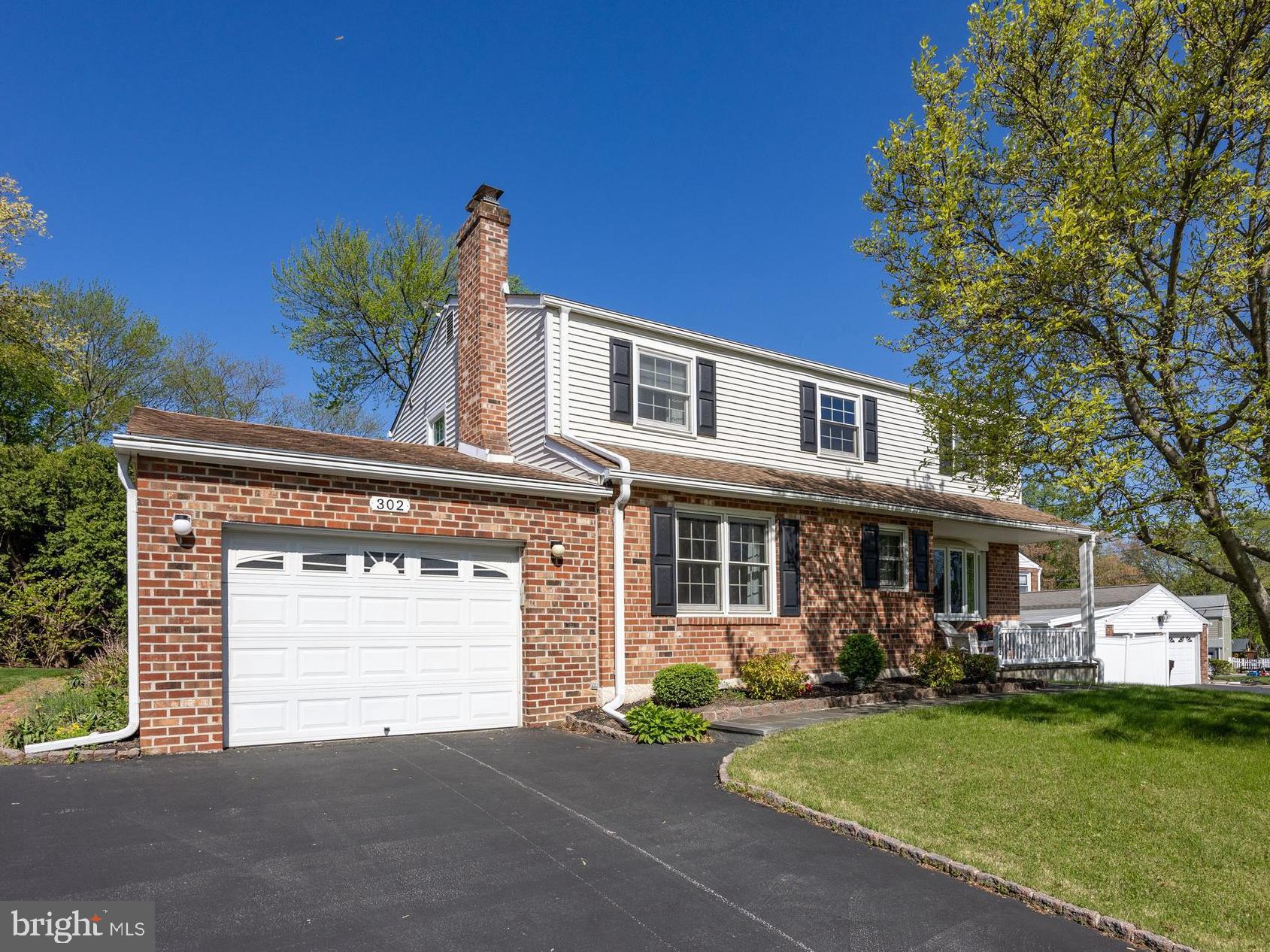 Welcome to 302 Rees Drive, a beautifully maintained home nestled in the highly desirable Sweetbriar community. Tucked away on a quiet street yet just moments from all the conveniences of King of Prussia, this charming home offers the perfect blend of serenity and accessibility. The charming front porch is a lovely place to sit and enjoy a cup of coffee! Step inside and be greeted by gleaming hardwood floors that flow seamlessly into an expansive living room, where a large bay window invites an abundance of natural light. The adjacent dining room provides an elegant space for hosting gatherings or enjoying intimate meals after a long day. At the heart of the home is the eat-in kitchen, thoughtfully designed with Corian countertops, a generous tile backsplash, an abundance of rich cherry cabinetry, and a spacious pantry. The breakfast area includes custom built-in cabinetry that offers additional storage, making this kitchen as functional as it is stylish. Just off the kitchen, the cozy family room with a gas fireplace sets the scene for warm, memorable evenings. For those who love indoor-outdoor living, the expansive three-season room is a true highlight, featuring skylights, ample space for lounging or entertaining, and easy access to the flat, private backyard. A powder room and access to the one-car garage complete the main floor. Let’s head upstairs and check out the second floor! There you'll find a spacious primary suite with a newly renovated en-suite bathroom and a large walk-in closet. Three additional well-sized bedrooms and a full hall bath provide comfortable accommodations for family and guests. The finished basement provides additional living space, perfect for a game room, fitness area, or media lounge. Additional features include replaced windows throughout the home, handy pocket doors on the main floor, built-in hampers in both full bathrooms, and a large storage shed in the backyard for your outdoor tools and equipment. Located within the award-winning Upper Merion School District and just minutes from Heuser Park, the Schuylkill River Trail, Valley Forge National Park, and the vibrant King of Prussia Town Center, this home offers an exceptional lifestyle and location. Don’t miss the opportunity to make 302 Rees Drive your forever home!