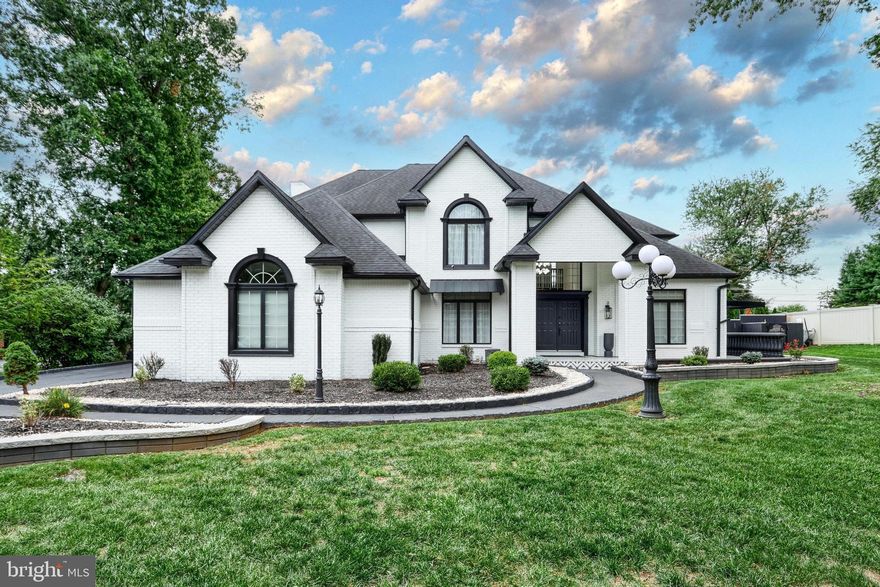 This fully renovated & upgraded 5-bed, 5.5-bath luxury home blends elegance & functionality. Freshly painted inside, 3x exterior stain & professionally landscaped, it feat HW flrs, recessed lts, & shadow box accents throughout the main level. Enjoy a private office w/French doors & illuminated built-ins, a formal dining room w/accent wall, & a living room w/Palladian windows. The spacious family room includes built-in shelving & a gas fireplace. The chef’s kitchen boasts stainless steel apps, granite counters, tiled backsplash, wall oven, electric cooktop on the center island, & pendant lighting. A full bath on the 1st floor is ideal after using the pool, alongside a laundry room & 1/2 bath. The owner’s suite includes oversized windows, walk-in closet, & a spa-like en-suite w/freestanding tub, dual vanities, & tiled walk-in shower. All bedrooms offer walk-in closets; the princess suite also features a vaulted ceiling & private bath. A hallway bath includes dual sinks & tiled shower/tub combo. The finished basement offers a sitting area, updated kitchenette, media room, guest bedroom, & luxurious full bath. Outside, enjoy a fully fenced yard w/mature privacy trees, paver patio w/tile inlay, new pergola, covered kitchenette w/Hardy panel finishes, & an in-ground pool w/waterfall feature. Covered front porch & 3-car garage w/extra-long driveway complete this spectacular home.