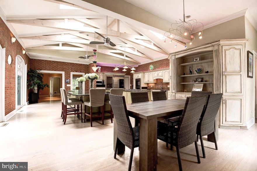 *** Open house tomorrow Tuesday November 4th , 5-7 PM*** Location, Location, Location *** Luxurious Living in Potomac Falls! Welcome to an extraordinary opportunity to own a one-of-a-kind residence nestled in a serene cul-de-sac-like setting in prestigious Potomac Falls. Robert G. Melby AIA Architect has Meticulously Expanded & Renovated, this elegant estate blends timeless design with modern sophistication, creating a true sanctuary just minutes from everything. A Grand First Impression! Step into luxury as you're greeted by an elegant circular driveway —setting the tone for the refined living experience that awaits. Chef’s Dream Kitchen with 2 huge Islands & Pro 48" Sub-Zero Refrigerator and 84" Sub-Zero Wine Cellar with Two-Drawer Refrigerator and Warming Drawers with Custom Cabinetry for unparalleled storage! Labradorite Blue Granite Countertops imported from the Island of Madagascar! A culinary masterpiece designed for both function and flair—ideal for the passionate home chef or grand entertaining. Luxury Home Theater Experience cinema-quality movie nights in your private theater, located in the stylishly finished lower level. Features acid-washed concrete floors and Aged Oakwood Walls add warmth and texture, A perfect blend of modern edge and cozy sophistication. Indoor-Outdoor Living at Its Best! Soaring ceilings and walls of glass flood the interior with natural light with Panoramic views of the professionally landscaped gardens and pool and Expansive open-concept layout perfect for both intimate gatherings and grand entertaining, stately columned breeze way which directs to Two-Level Pool House Retreat Complete with 3 full bathrooms, Ideal for guest accommodations, entertaining, or a tranquil private retreat! Unbeatable Location Only 2 miles to Potomac Village Shopping Center and 8 miles to Mclean and Tysons Corner and 12 miles to Georgetown! Enjoy the perfect blend of privacy and proximity—luxury, space, and convenience all in one coveted address. Don’t Miss This Rare Opportunity! Homes like this don’t come around often. Discover a lifestyle of distinction in Potomac Falls.