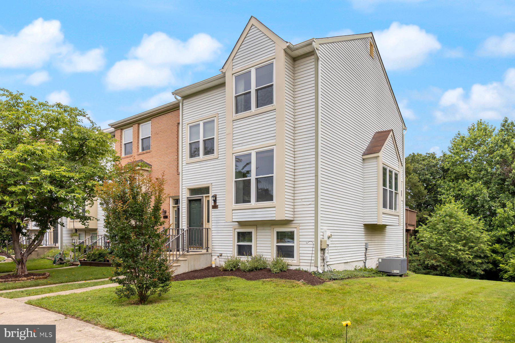 Discover the charm of this 4-bedroom, 2.5-bath split-level end-unit townhouse, filled with natural light from abundant windows. The main level features hardwood floors, stainless steel kitchen appliances, and a spacious deck, perfect for outdoor entertaining. A fully finished basement provides flexible space for a media room, home office, or guest suite. Classic design meets everyday convenience in this inviting home.