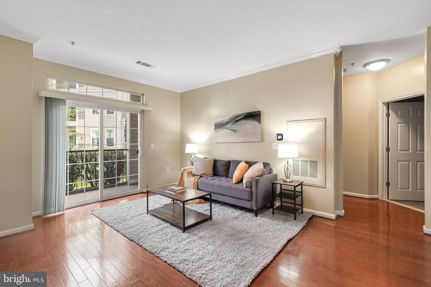Lovely 1-bedroom, 1-bathroom home at The Grove, a luxury condo community in Arlington! A tiled entry welcomes you into this freshly painted home, offering a clean and inviting feel throughout. Just off the entry, you’ll find a convenient laundry closet with a full-sized washer & dryer plus overhead shelving for added storage. The kitchen is well-appointed with granite countertops, ample cabinetry, and stainless steel appliances - perfect for everyday cooking and entertaining. The spacious living room features gleaming hardwood flooring, crown molding, and a sliding glass door that opens to your private balcony, creating a seamless indoor-outdoor living experience. The bedroom offers a comfortable retreat with plush carpeting, a ceiling fan with overhead lighting, and a walk-in closet. The bathroom is thoughtfully designed with tile flooring, an oversized stone-topped vanity, a medicine cabinet, and a sparkling white tiled shower with tub. A linen closet provides additional storage and convenience. Additional home features include a separate storage unit (#21A) and one assigned parking space in the covered garage (#66). 

Residents of The Grove enjoy a wide range of amenities, including a state-of-the-art fitness center, community pool, landscaped courtyard with gas and charcoal grills, and a clubhouse complete with a media room, café, billiard table, concierge service, package room, and bike storage. Ideally located just minutes from DC, with easy access to the Pentagon, Pentagon City, Shirlington, Del Ray, and Old Town Alexandria, this home is also close to walking and biking trails and a nearby dog park - offering the perfect blend of comfort, convenience, and community.