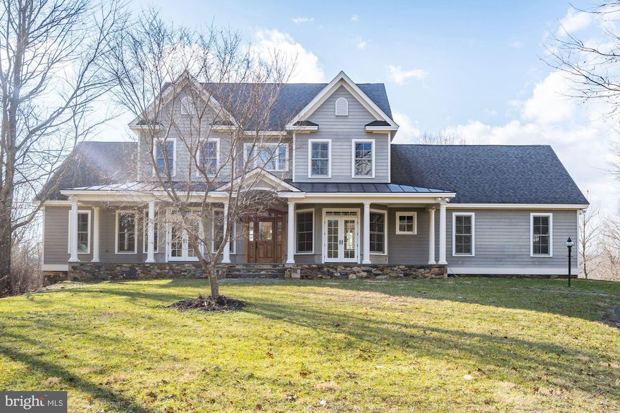 Custom home built on over four and a half acres with large rocking chair front porch! Gorgeous hardwood floors on main level and large kitchen!  First floor master and two story family room! Top level has three spacious bedrooms plus bonus room with sky lights!  Large basement with rec room, bedroom and full bath plus unfinished storage!  This home is bright, open and has great views of the Loudon County hillsides! Great location in the middle of horse and wine country!  To help visualize this home's floorplan and to highlight its potential, virtual furnishings may have been added to photos found in this listing.
