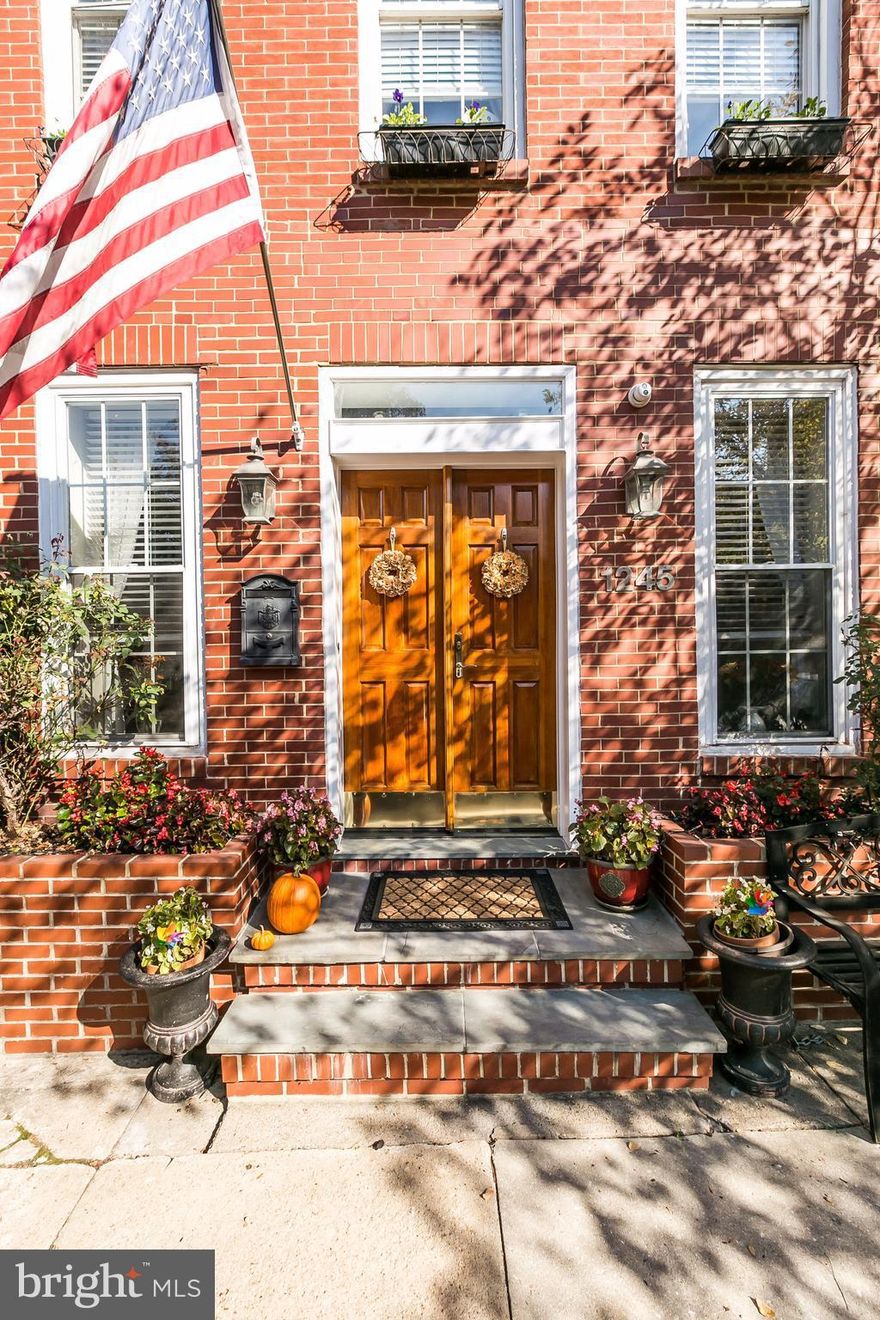 Rare find in Federal Hill! Don't miss this immaculately maintained extra wide 3 story row home featuring wood floors, working fireplace, large rooms and fabulous outdoor space. Great layout with 3BR, 2 baths, deck off master bedroom, trex roof deck, plus a 2 story 1 car garage with bonus room that's perfect for home office. Enjoy the amazing private courtyard perfect for relaxing or entertaining.