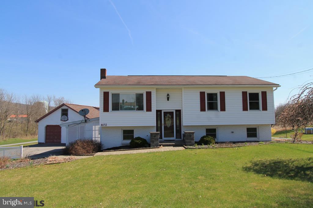 Move right in to this great split entry home in Bellefonte! Abounding with space, this home has everything done including the siding, roof, windows, heat pump, flooring, kitchen, baths and landscaping! With 5 bedrooms & 3 full baths, there is plenty of space for everyone. The updated kitchen is open to the dining & family room areas which feature lots of natural light & sliding doors to the back deck. Relax & enjoy your morning coffee on the covered back deck designed with skylights & composite decking that overlooks the countryside. The large master bedroom features 2 large closets and a private bath w/ walk-in shower, heated floors & beautiful claw foot soaking tub. The basement is perfect for entertaining w/ lots of open space and a cozy gas fireplace along with two additional bedrooms, a full bath & large laundry room. The detached two-story garage is oversized making it perfect for multiple vehicles or hobbies along w/ an upper level that's ideal for additional storage.