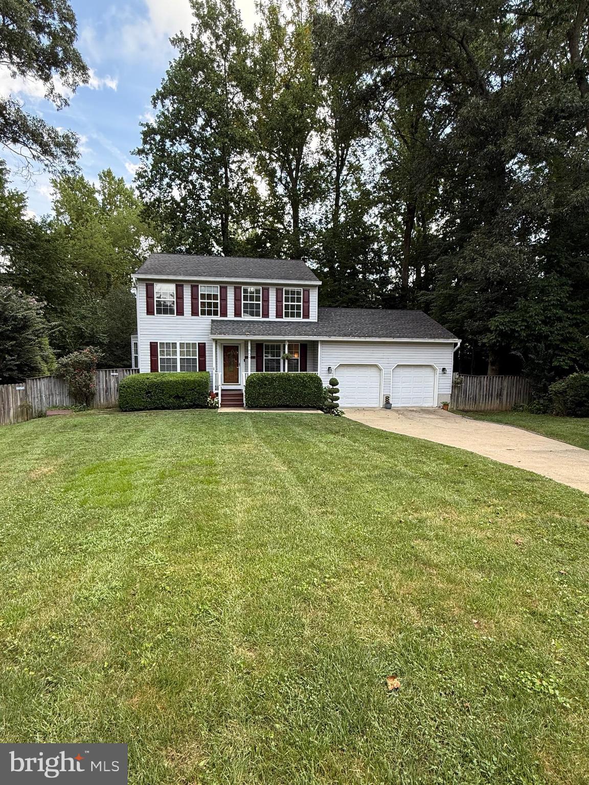 Spacious 4-bedroom, 3.5-bathroom home featuring gleaming hardwood floors on the main level and a beautifully updated kitchen perfect for entertaining. The finished basement provides additional living space, while the private, fully fenced backyard offers a peaceful outdoor retreat. Enjoy your morning coffee or an evening drink on the large deck. Convenient 2-car garage. Very convenient location to local shops, restaurants, the DC commuter bus, and major highways.
