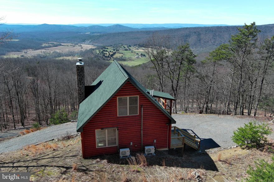 PANORAMIC PROTOTYPE....WHEN YOU DAYDREAM ABOUT THAT LITTLE GETAWAY CABIN IN THE MOUNTAINS, IT LOOKS JUST LIKE THIS! ADORABLE LOG SIDED CHALET ON 27 WOODED ACRES WITH JAW DROPPING, 180 DEGREE, PANORAMIC VIEWS OF WESTERN MOUNTAIN RANGES , THE SOUTH BRANCH OF THE POTOMAC RIVER AND VALLEY FARMS BELOW. THE CABIN IS IN GREAT SHAPE AND FEATURES A HUGE LOFT THAT WILL HOLD MULTIPLE GUESTS, WOOD BURNING FIREPLACE AND DOUBLE DOOR IN BASEMENT ALLOWS UNLIMITED ATV & TOY STORAGE. CONVEYS TURNKEY AND READY TO USE THE DAY YOU CLOSE. LIKE TO HUNT? ANY TYPE OF GAME YOU WANT TO PURSUE CAN BE FOUND ON THIS LAND. PARADISE FOR THE OUTDOORSMAN......LESS THAN 5 MILES FROM 3 PUBLIC ACCESS POINTS ON THE SOUTH BRANCH OF THE POTOMAC RIVER FOR UNLIMITED FISHING & FLOATING.....FROM YOUR FRONT DECK, YOU'RE STARING AT "WHITE HORSE MOUNTAIN WILDLIFE MANAGEMENT AREA" 1756 ACRES OF PUBLIC HUNTING & HIKING.....ONLY 5 MILES AWAY! LOCATED IN THE DEVELOPMENT OF "SHADOW KNOLLS" AN 800 ACRE COMMUNITY COMPRISED OF ONLY 28 TRACTS, MOSTLY WEEKENDERS WITH ONLY A FEW FULL TIMERS, VERY LOW KEY AND PRIVATE.....HOA DUES ONLY $225 PER YEAR. COMMUNITY DOES NOT ALLOW SHORT TERM RENTALS. ONLY 2-2.5 HOURS FROM THE DC/BALT METRO AREA.....THIS ONE'S A SLAM DUNK, NO BRAINER.....IF YOU'RE NOT HERE FIRST, YOU'RE GONNA BE LAST!