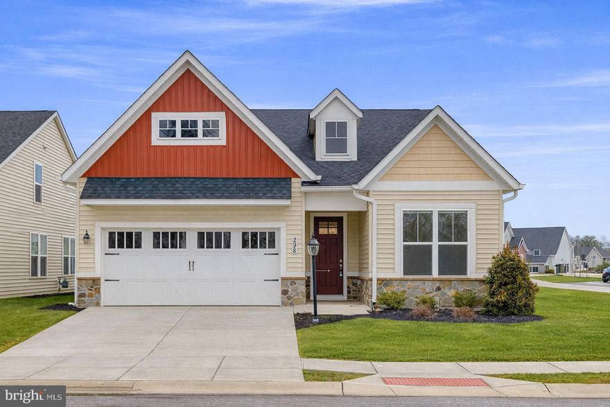 Experience effortless living at Pennsylvania’s premier 55+ resort-style community, where you can enjoy a nearly new home—without the premium pricing or long wait of new construction. Set on a rare, corner lot just steps from the community garden, this thoughtfully designed 2022 Caruso Kellaway model blends comfort, luxury, and everyday functionality.
Step inside to soaring 9-foot ceilings and beautiful luxury vinyl plank flooring that create an immediate sense of warmth and sophistication. At the center of the home, the gourmet kitchen is both stunning and practical, featuring quartz countertops, an expansive island, soft-close cabinetry, GE appliances, a double oven, additional storage, and a well-appointed butler’s pantry. The open-concept layout connects seamlessly to the dining and living areas, offering an inviting space for entertaining or relaxed evenings at home.
Unwind by the cozy gas fireplace or step outside to the private, covered patio—already wired for a hot tub or fire pit—perfect for enjoying the outdoors year-round. The owner’s suite provides a peaceful retreat with dual quartz vanities, a floor-to-ceiling tiled shower, and a spacious walk-in closet complete with custom shelving and double hanging rods.
A centrally located flex room with double French doors offers endless possibilities, whether you envision a home office, library, or hobby space. Additional highlights include a private guest bedroom and full bath at the front of the home, a spacious laundry and utility room, a two-car attached garage, whole house water softener system, and a generous seven-foot hallway closet for added storage.
Southern exposure and additional windows fill the home with natural light throughout all four of Gettysburg’s seasons including great views over the pond and wonderful sunsets. Thoughtful upgrades include crown molding in main living areas, premium Hunter Douglas top-down/bottom-up window treatments, plantation shutters, enhanced lighting and electrical features, and custom wood shelving throughout.
With lawn care, landscaping, and snow removal included in the HOA, this home delivers truly maintenance-free living—so you can focus on enjoying the lifestyle you’ve earned.

Qualified Veteran to assume 3.55% mortgage!