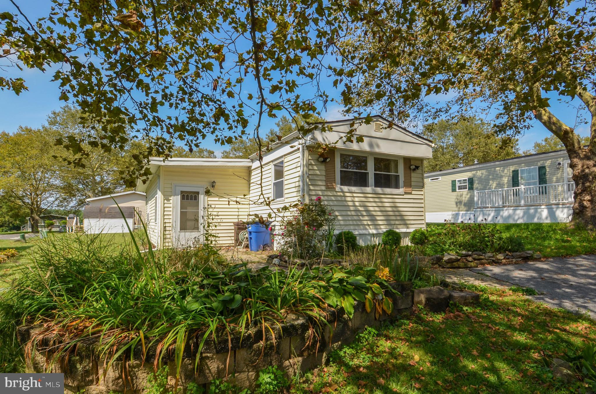 3 BR, 2 full bath mobile home in desirable Hickory Hills park! This home is especially spacious, with a main bedroom and ensuite bath on one side of the home, and second bedroom and Jack and Jill hall bath on the other side of the home. In the center of the home are a living room, galley style kitchen, laundry room and entrance to the back deck. There is a third bedroom off of the foyer entryway, so there is room for everyone! Outside, there is a large covered deck, storage shed, pond, and off street parking. Home is ready for a new owner to breathe fresh life into it! Call today!