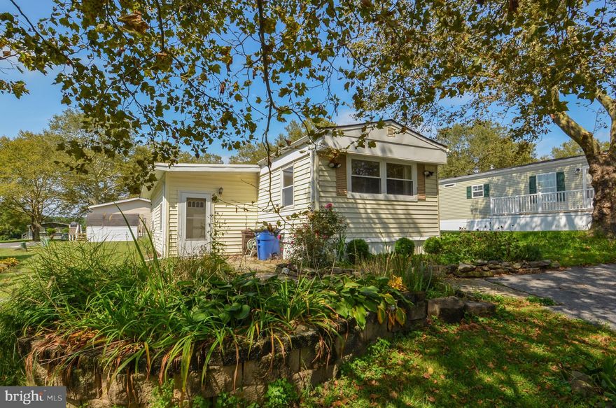 3 BR, 2 full bath mobile home in desirable Hickory Hills park! This home is especially spacious, with a main bedroom and ensuite bath on one side of the home, and second bedroom and Jack and Jill hall bath on the other side of the home. In the center of the home are a living room, galley style kitchen, laundry room and entrance to the back deck. There is a third bedroom off of the foyer entryway, so there is room for everyone! Outside, there is a large covered deck, storage shed, pond, and off street parking. Home is ready for a new owner to breathe fresh life into it! Call today!