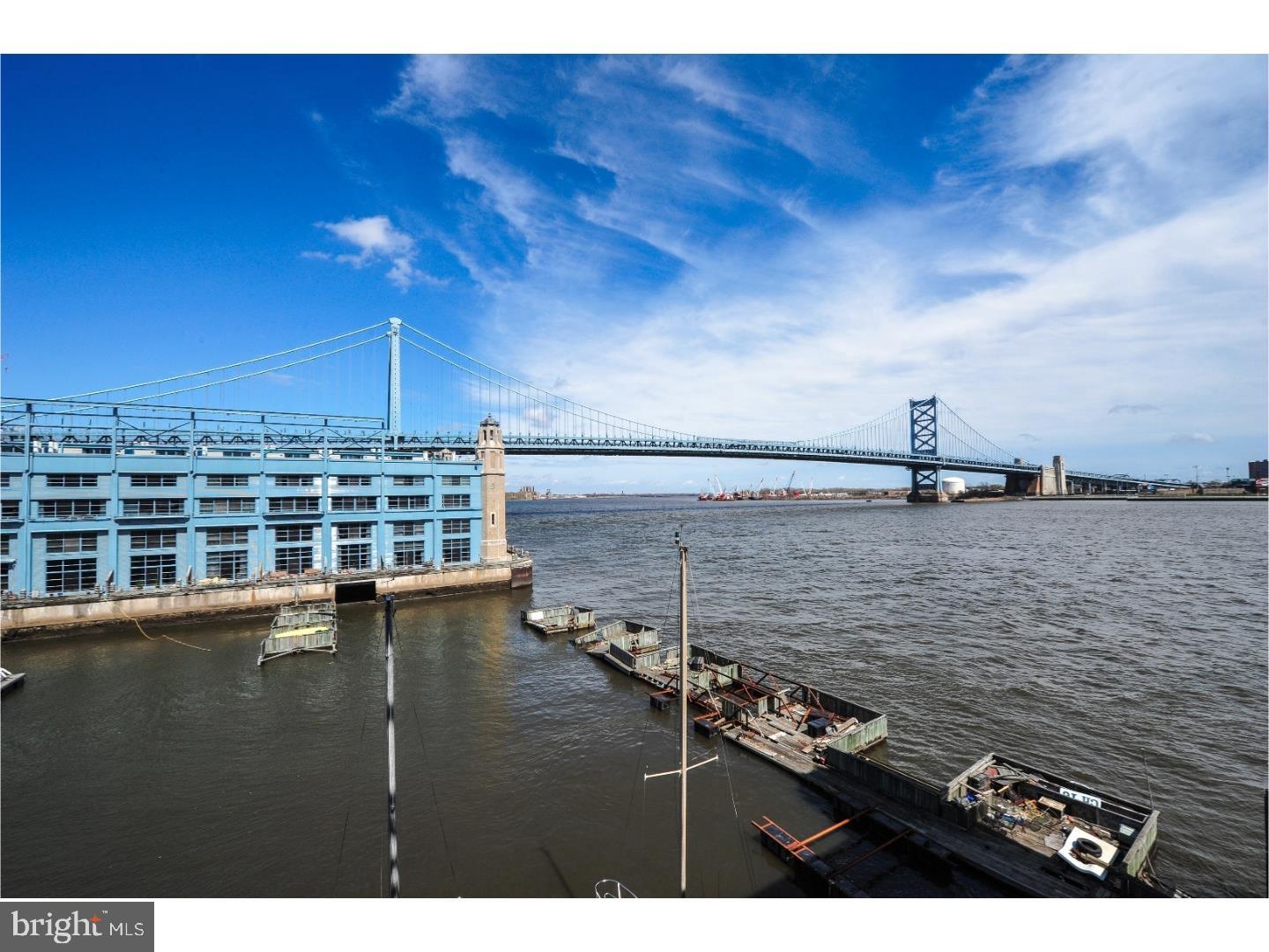 Incredible renovation at Pier 3: completely overhauled in 2014, sought-after split floor plan with extraordinary views of Ben Franklin Bridge, Marina, and Delaware River. Custom kitchen with cherry cabinets, GE Profile appliance suite and natural stone counters opens to living/dining room floor-to-ceiling windows/sliders and large terrace. Master suite has walk-in closet with custom organizers and statuary marble-clad master bath with custom cabinetry/vanity and frameless glass shower enclosure. 2nd bedroom (separate access to terrace) with walk-in closet, and hall bath with gray slate, custom vanity, and tub with sliding, frameless glass doors. Hand-scraped hardwood flooring and recessed lighting/dimmers throughout. Separate laundry off kitchen, and huge storage/entry closet. Includes secure 1-car garage parking. Pier 3 is full service building with 24/hour concierge, heated indoor pool, fitness center, common deck at end of pier for fireworks, etc... Recently updated lobby/common spaces. Easy access into/out of the city via public transport or area highways.