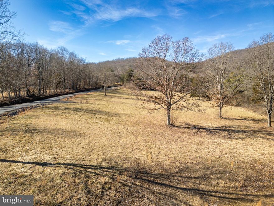 Discover the perfect slice of West Virginia paradise with 1.35 acres of prime, unrestricted land. This listing is for Lot 2, but Lot 3 is also for sale, buy them both to get 2.7 acres! With no HOA!  The only thing not aloud are single-wide trailers, so you have the freedom to create a cozy homestead or build your dream home. Picture yourself on your future deck, savoring breathtaking views of valley mountains during the day and stargazing under the pristine night sky. Public water hook-ups, available electricity, and the guidance of a reputable contractor-owner make these lots an exceptional find. Just a short drive from Moorefield (15 mins)  and Romney (25 mins), and a convenient 2 hours and 20 minutes from Washington, DC, these lots offer the ideal blend of rural serenity and accessibility.