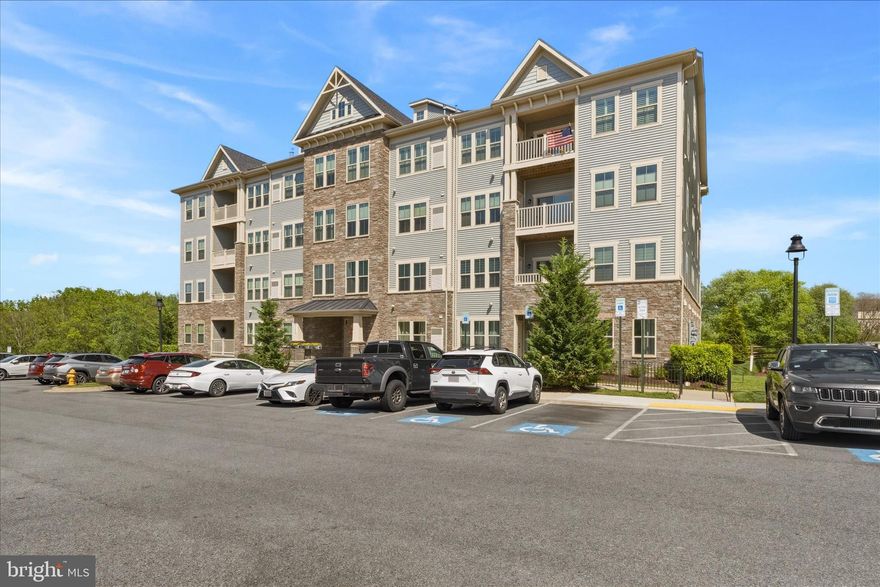 This is NOT the average condo building! Turn Key, Meticulously cared for condo in a desirable elevator building in Lake Linganore! This bright and spacious open-concept home features durable LVP flooring throughout the main living areas and a sliding glass door leading to a private deck overlooking peaceful wooded views. The gourmet kitchen offers granite countertops, abundant cabinet space, and ample storage. The spacious primary suite includes two deep closets and en-suite with dual sinks, and a large walk-in shower. The second bedroom also features deep closets and its own private bathroom.  Parking here is easy, lots of parking spaces out front as there open space of one side of the building. Easy walk to the schools and shopping across the street. Easy commuter access to I-70. HOA fees includes all that Lake Linganore has to offer!